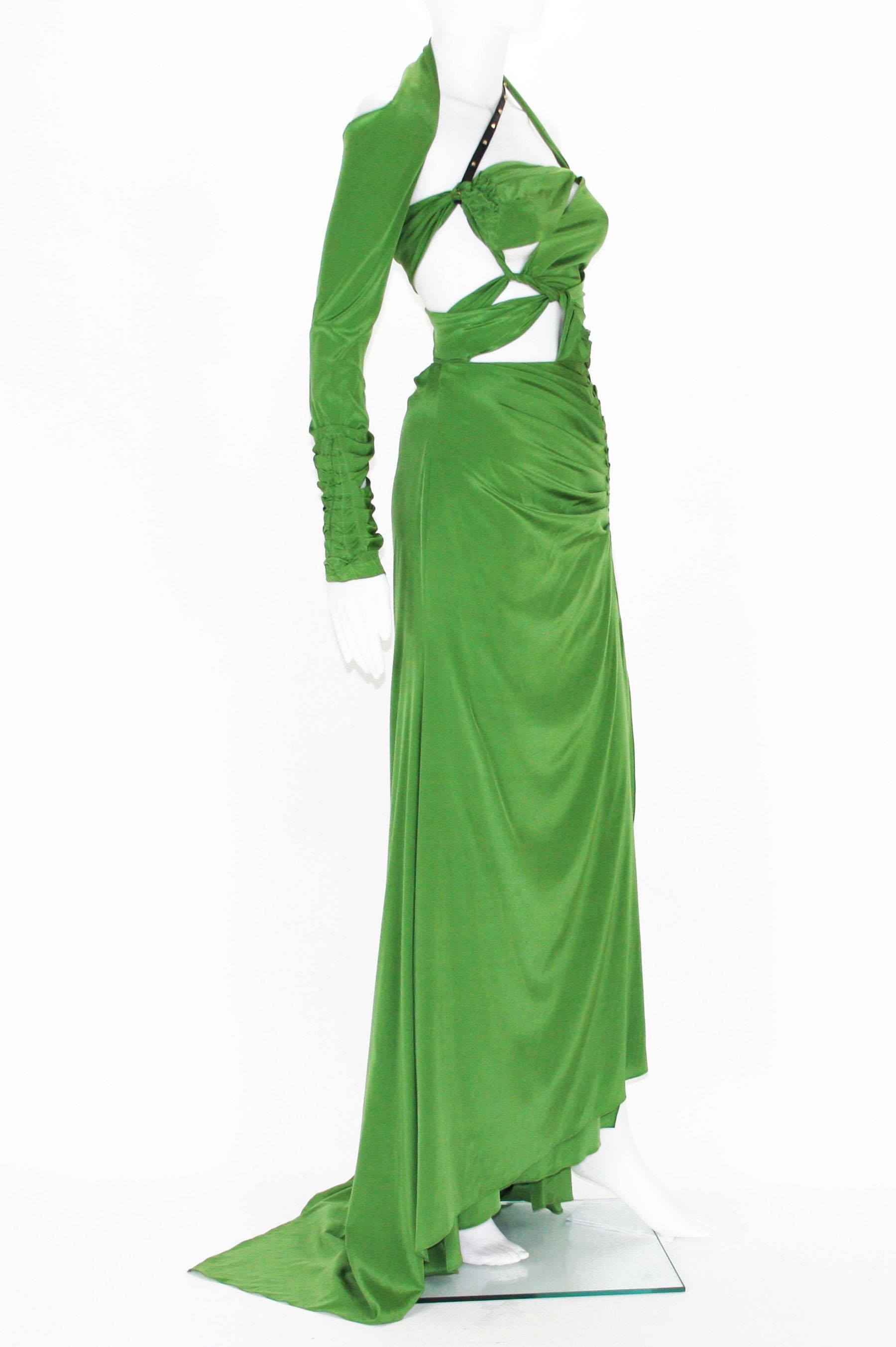 Tom Ford for Gucci Silk Green Bondage Long Dress Gown
2003 Collection, Limited Edition.
Designer size - 42 (run smaller)
85% Silk, 10% Spandex, 5% Leather.
Cut-out and ruched design, leather studded strap, high slit, side zip closure, very