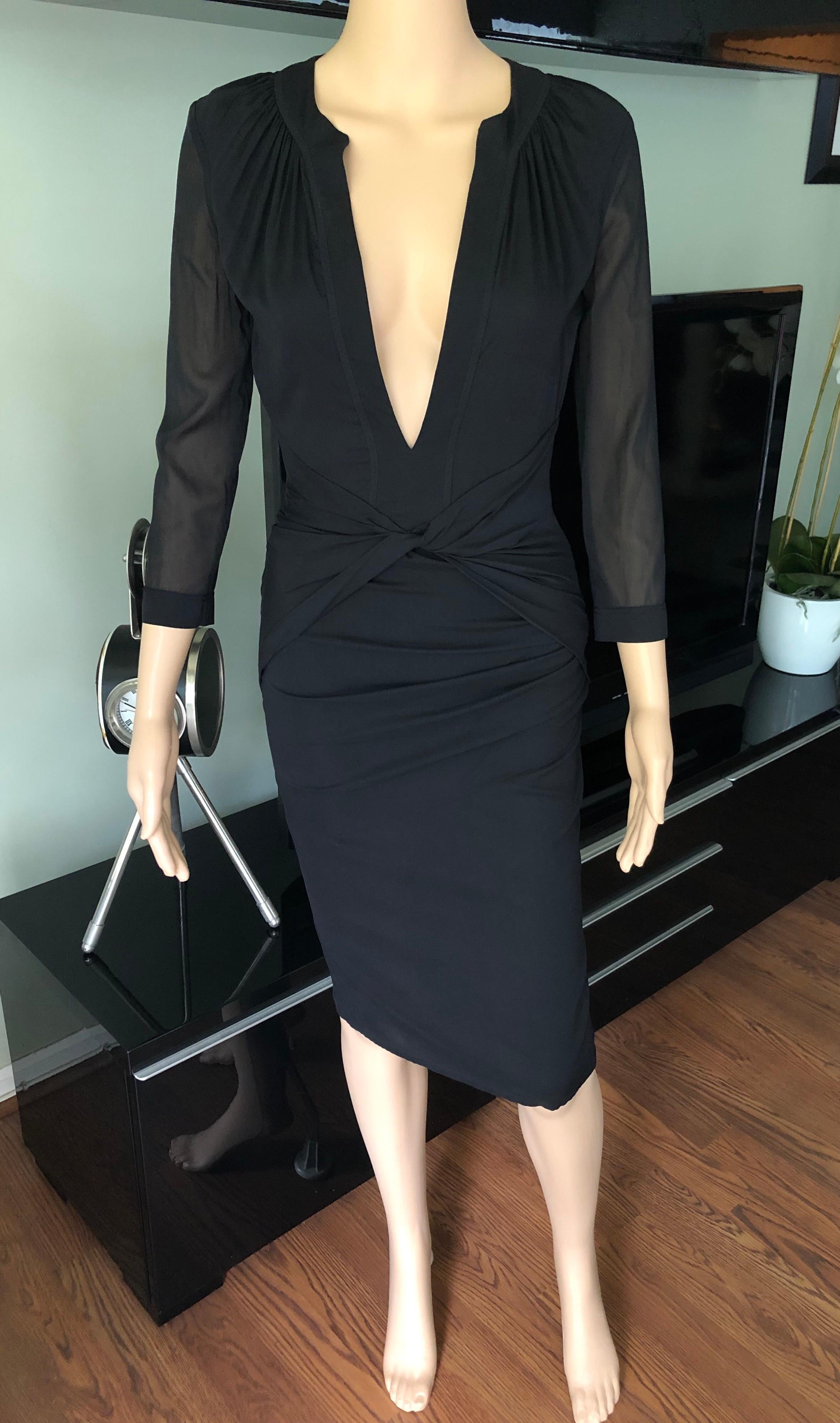 Tom Ford for Gucci 2004 Plunging Neckline Sheer Panels Silk Black Dress IT 38

Gucci black dress featuring plunging neckline , ruching accents at front, sheer sleeves and panels in the back and concealed zip closure at side. 

