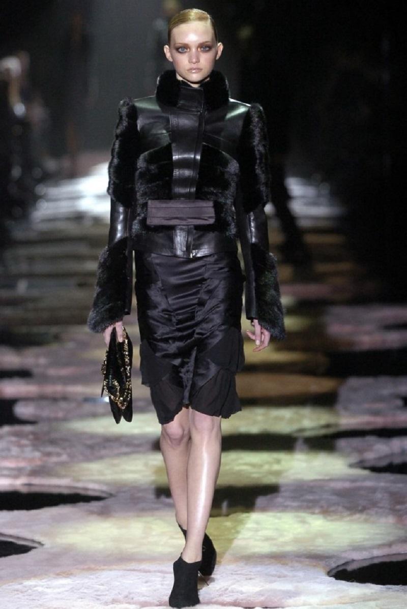Tom Ford for Gucci Limited Edition Runway Python Dragon Brooch Shoulder Bag
F/W 2004 Runway Collection
Elegant black python skin shoulder bag with gold-tone bamboo double chain shoulder strap, dragon metal brooch adorned with Swarovski crystals and