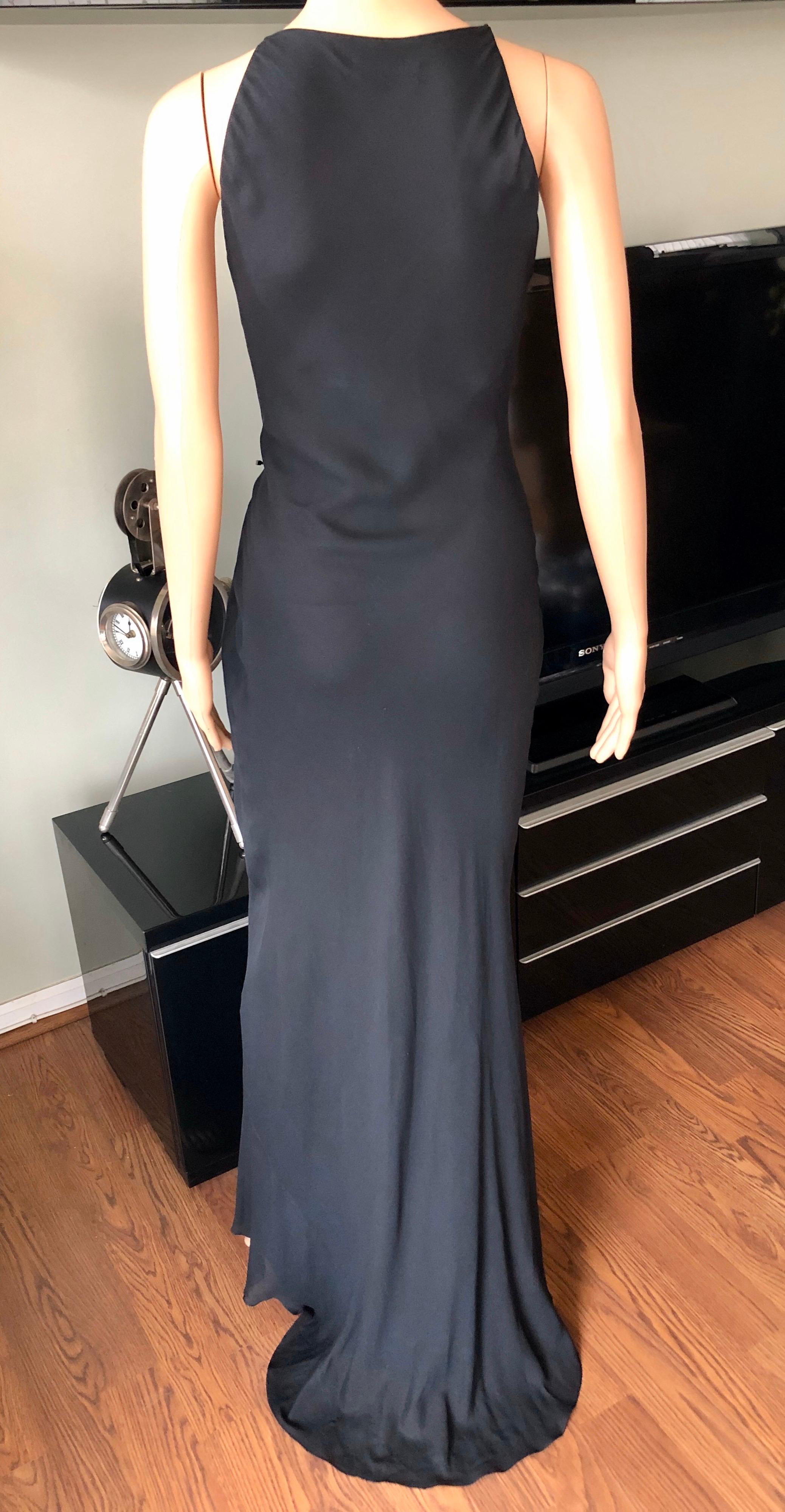 Tom Ford for Gucci c. 2000 Sheer Silk Black Maxi Evening Dress IT 40

Gucci by Tom Ford sheer silk maxi dress with V-neck, knotted accent at waist and concealed hook-and-eye closure at shoulder.
