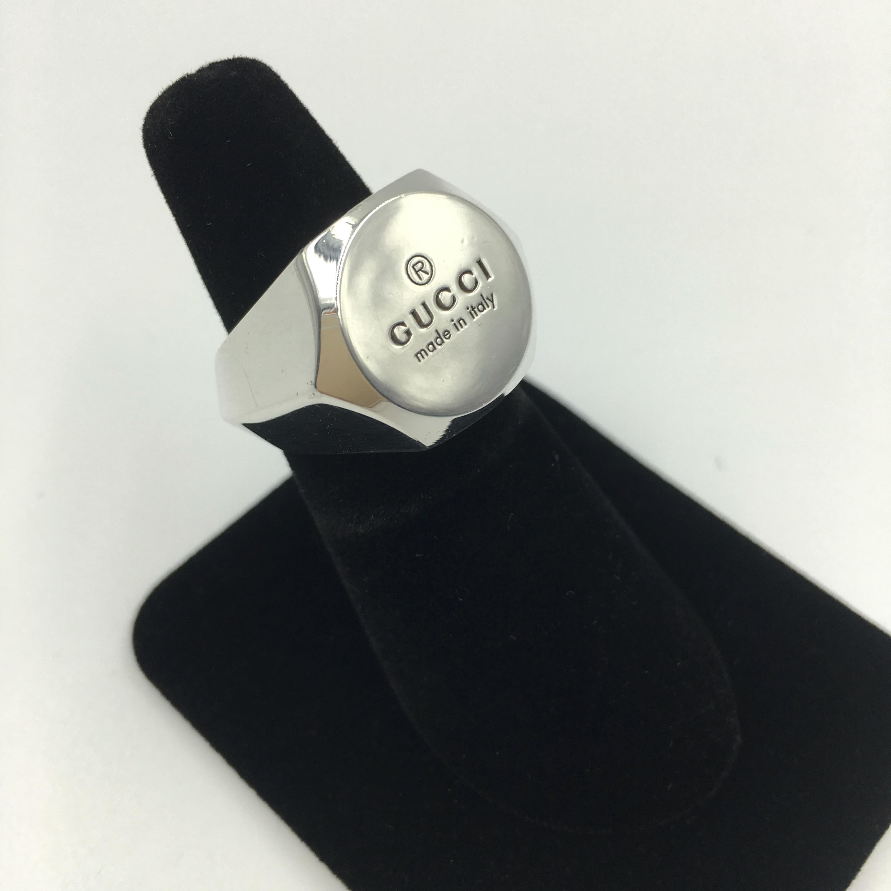 Tom Ford for Gucci Engraved Logo Sterling Silver Signet Ring. Stamped Gucci and 925 inside. 
Ring size US 7 1/2. See measurements to compare to a ring you already own.
Good vintage condition.

Outer measurements are as follows:
Width-