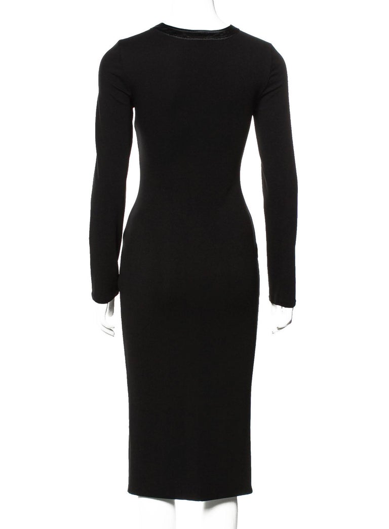 Tom Ford for Gucci Black Stretch Dress
F/W 2002 Collection
Designer size - 38
Deep V-neck style, Black satin trim, Removable tie, Very stretch.
Made in Italy
Excellent new condition.

Listing code: 02202054580224958