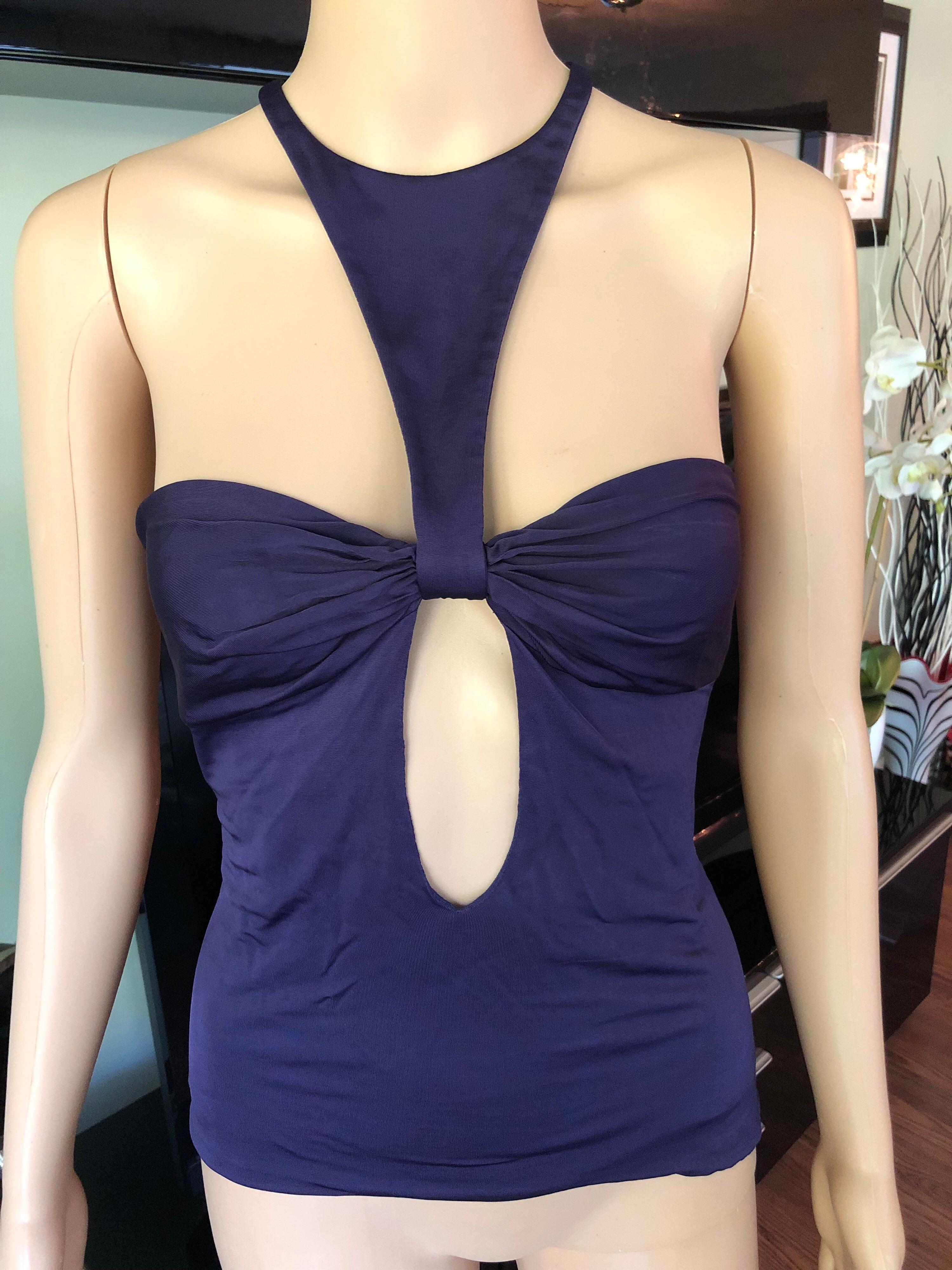 Tom Ford for Gucci F/W 2004 Cut-Out Top IT 44

Purple Gucci sleeveless top featuring plunging neckline, keyhole at front and back and concealed zip closure at side.
