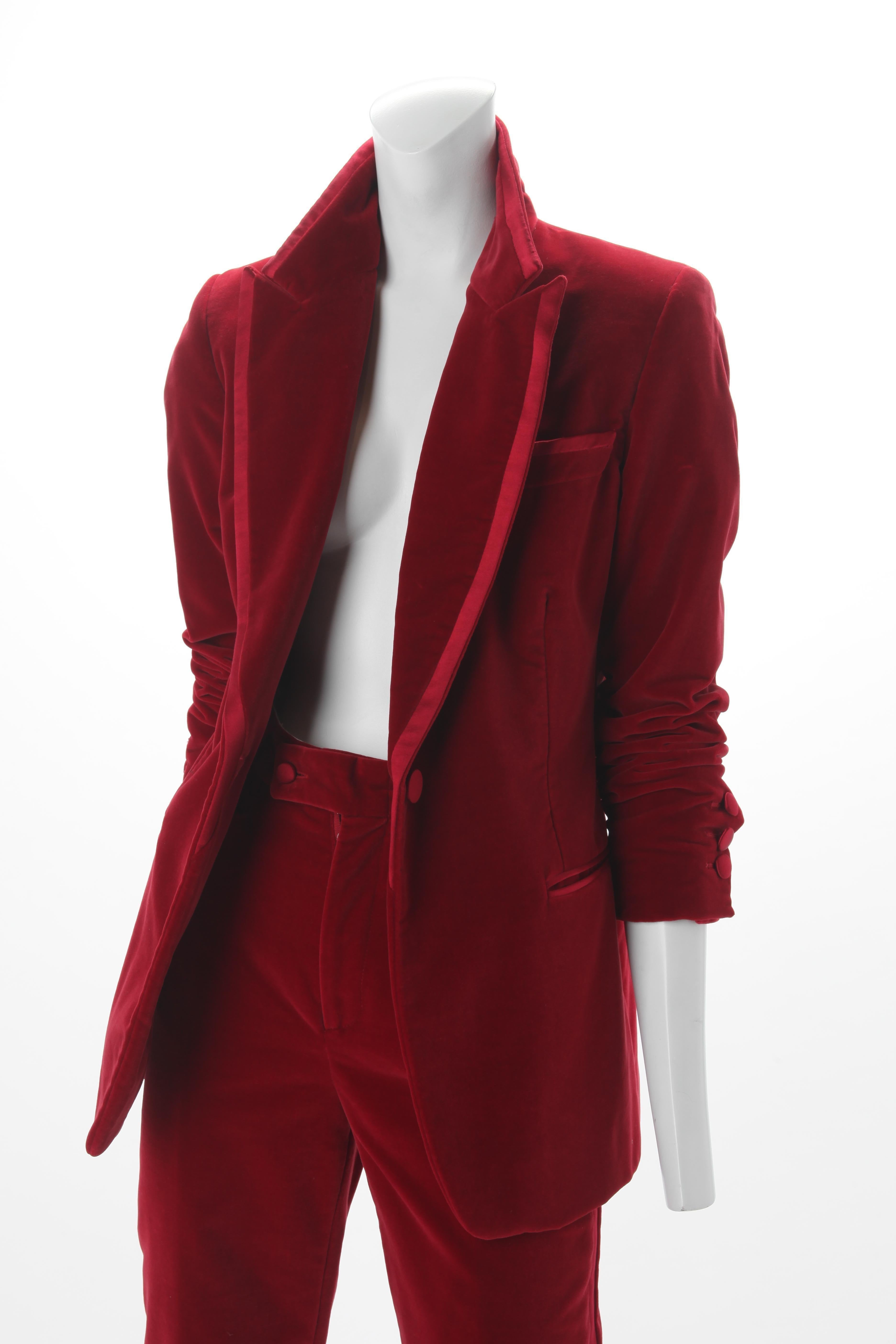 Tom Ford for Gucci Iconic Red Velvet Tuxedo Suit, Autumn/Winter RTW 1996.
Tom Ford for Gucci, Autumn-Winter 1996, red cotton velvet Tuxedo Suit. Jacket features dual welt pockets at waist, slit pocket at bust, contrast panel at collar and single