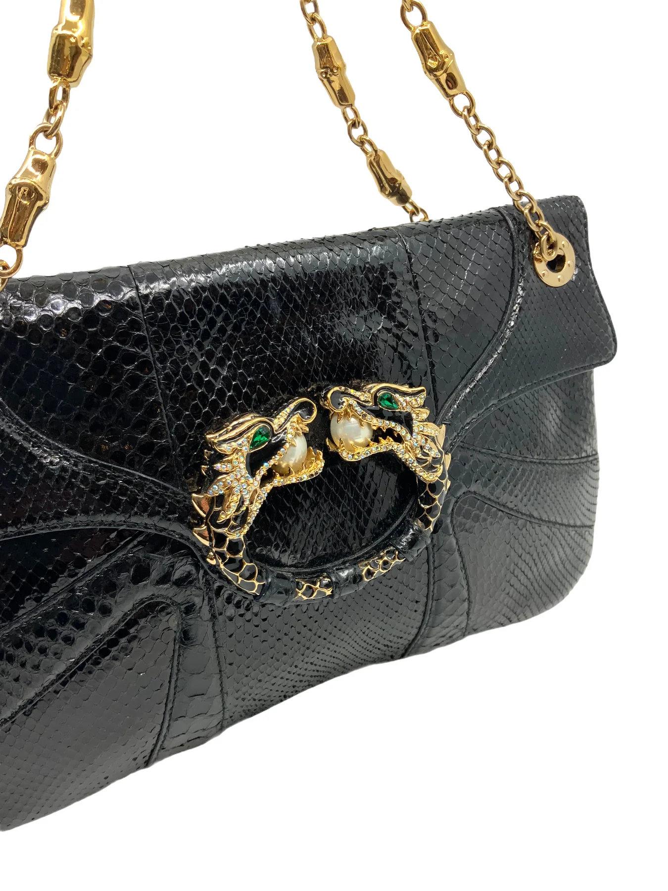 Gucci Limited Edition Tom Ford for Gucci

Leather Jeweled Dragon Bag featuring gold-tone chain link shoulder straps and a crystal-embellished double headed dragon on the flap.
Black snakeskin 
Double chain link straps, 7