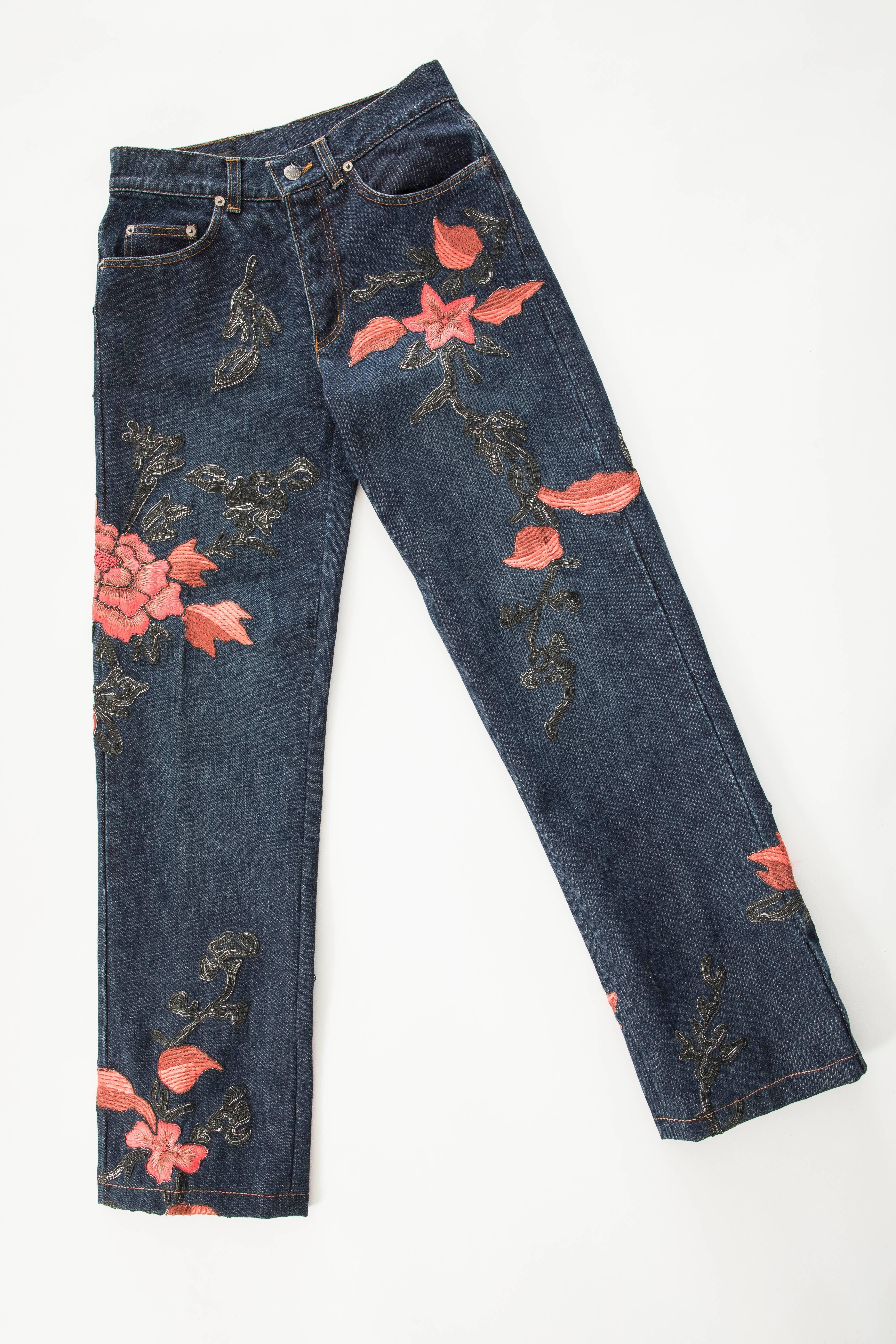 Tom Ford for Gucci, Autumn-Winter 1999, floral embroidered men's denim jeans with five pockets, gunmetal-tone hardware, belt loops, leather logo at back and contrast stitching and signature button fly closures.

IT. 38, US. X-Small
Waist 28, Hips