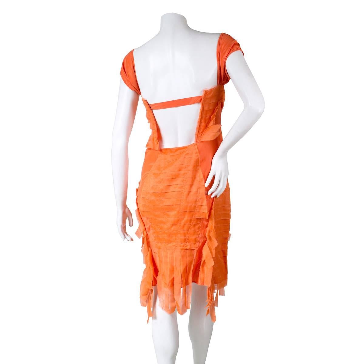 Dress by Tom Ford for the Gucci S/S 2004-2005 collection
Shredded silk strips 
Side zipper closure
90% silk, 10% spandex
Condition: Excellent, new with tags NWT

Size/Measurements:
Italian size 44
34