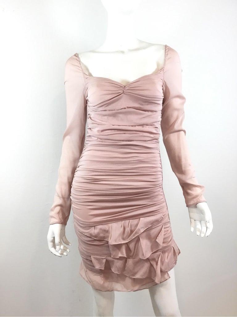 Gorgeous Runway dress from Tom Ford for Gucci’s 2003 Spring collection. Dress is featured in a nude pink color, composed of a silk and spandex blend, labeled Size 38, made in Italy. Dress has an open back with strappy detail across the back and a