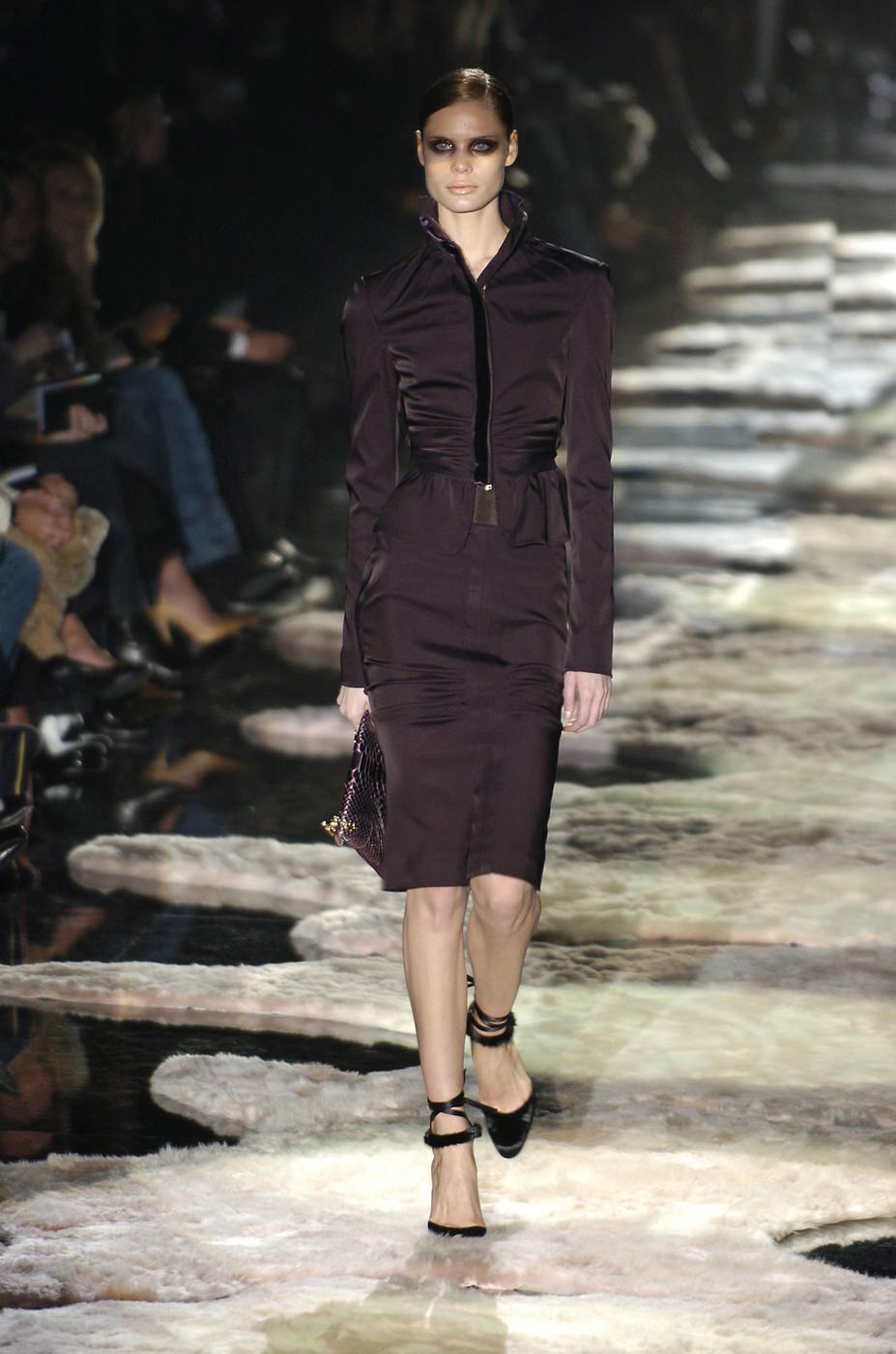 Tom Ford for Gucci Aubergine Stretch Dress Skirt Suit
F/W 2004 Collection - Look # 1
The emotional ending of the Tom Ford era at Gucci was a look back in glamour—a fabulous farewell in which this perfection-obsessed superstar of fashion seized the