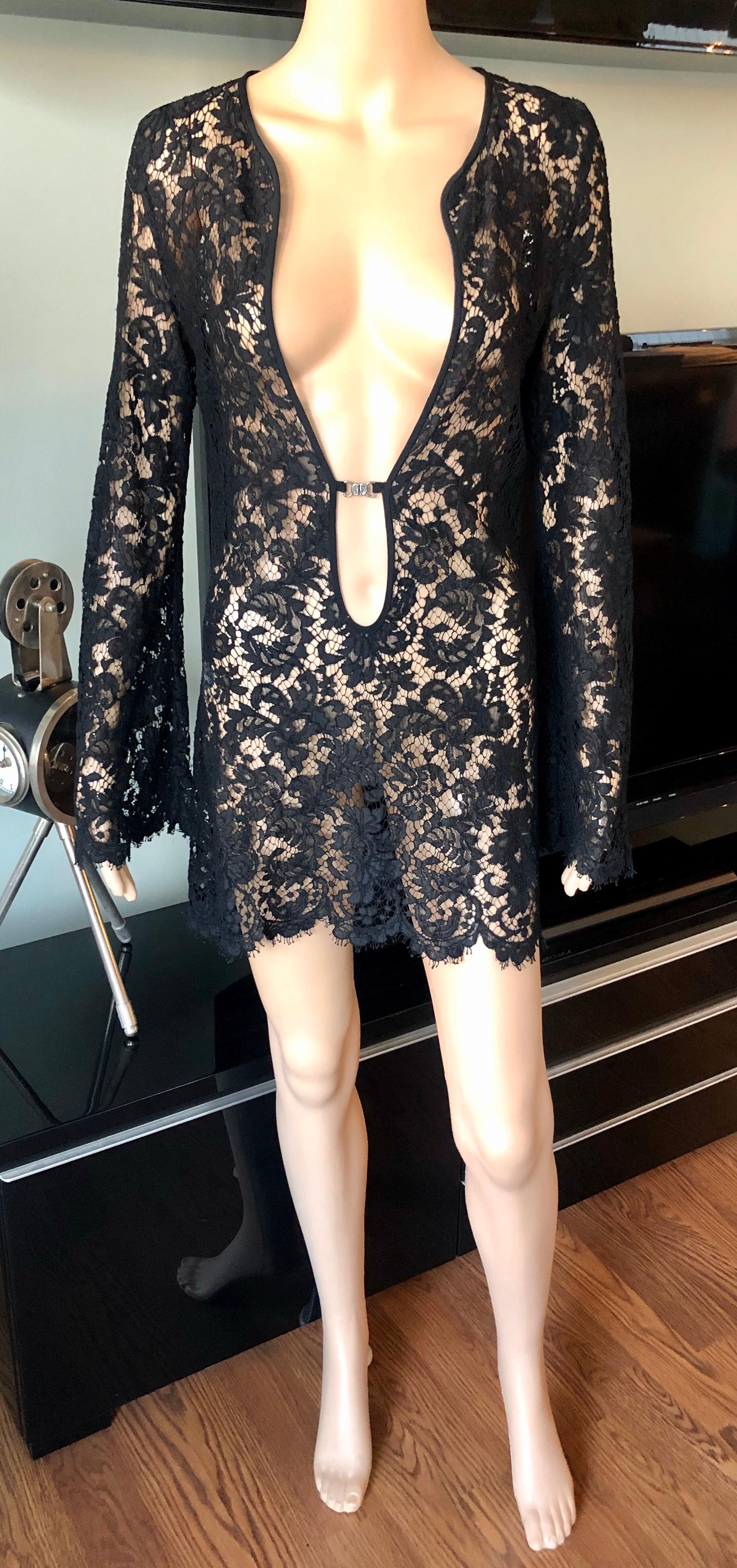 Tom Ford for Gucci S/S 1996 Runway Plunging Sheer Lace Black Tunic Mini Dress IT 46

Tom Ford for Gucci black sheer lace mini dress featuring plunging neckline with logo closure in front. 