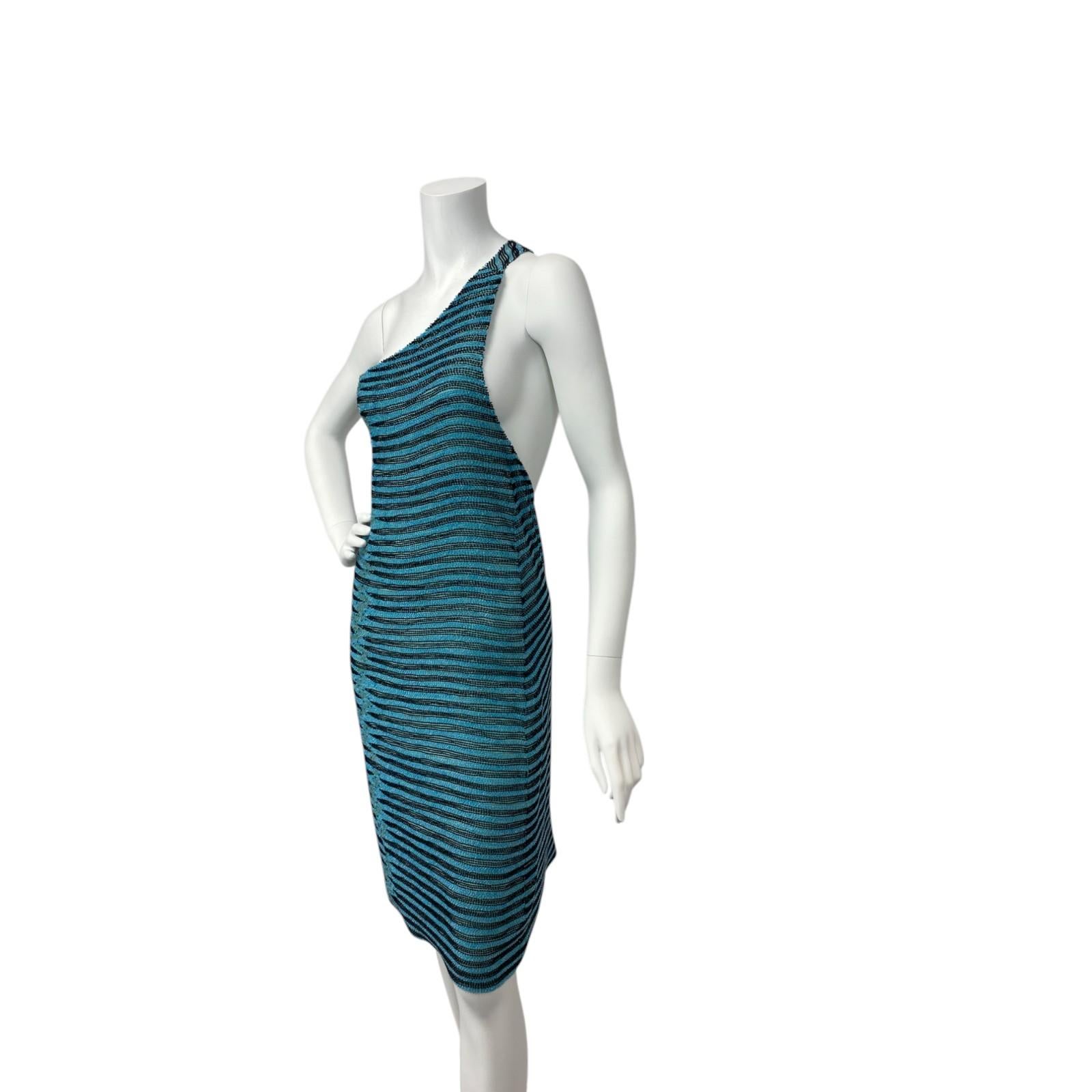 A rare and highly collectible piece from Tom Ford’s Spring/Summer 2000 collection for Gucci, this turquoise beaded mini dress is the epitome of turn-of-the-millennium glamour. The dress is intricately hand-embroidered with shimmering tonal beads