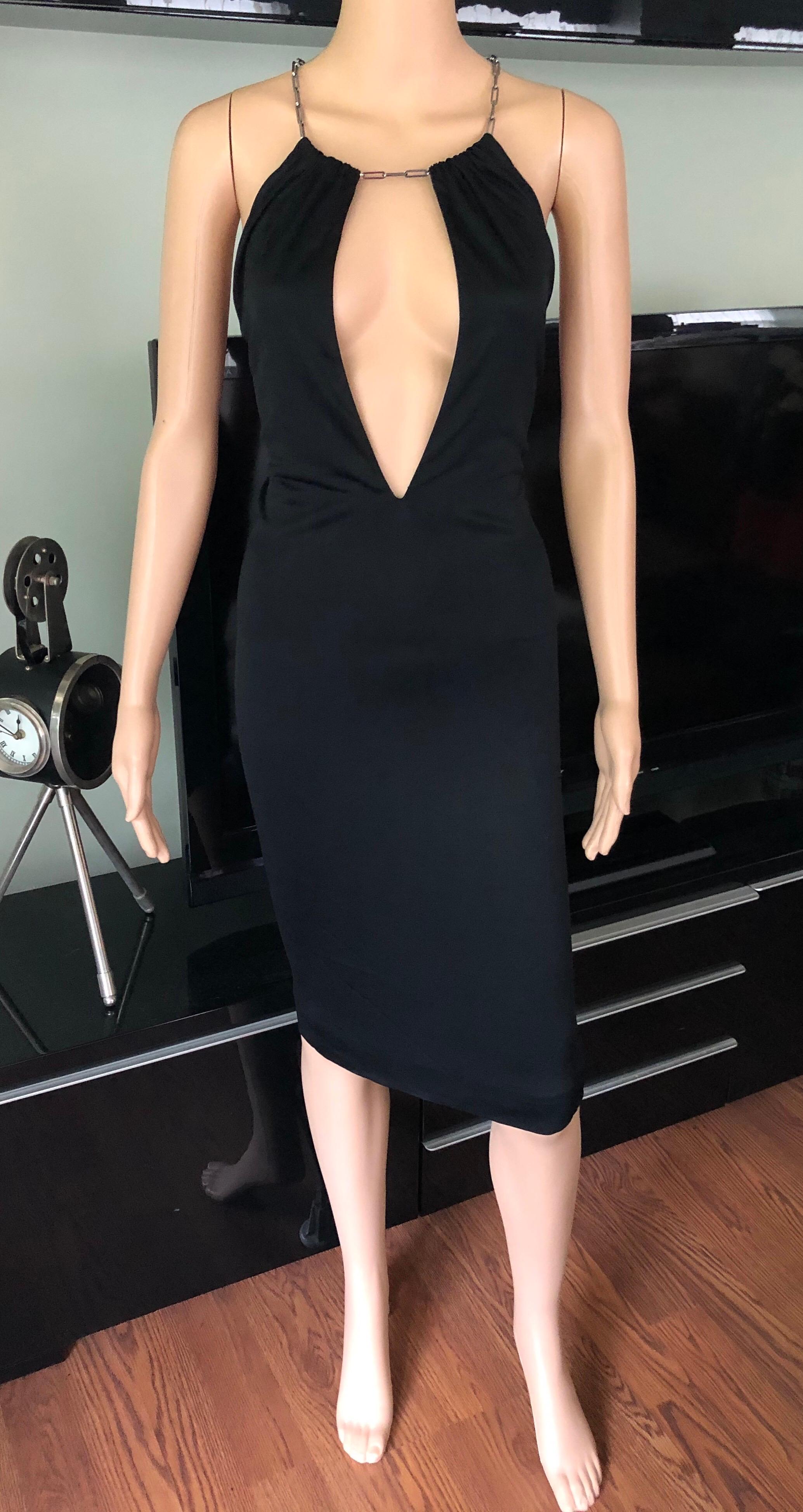 Tom Ford for Gucci S/S 2000 Plunging Neckline Halter Black Dress IT 38

Gucci midi dress featuring halter neck with cutout and chain at neck. 