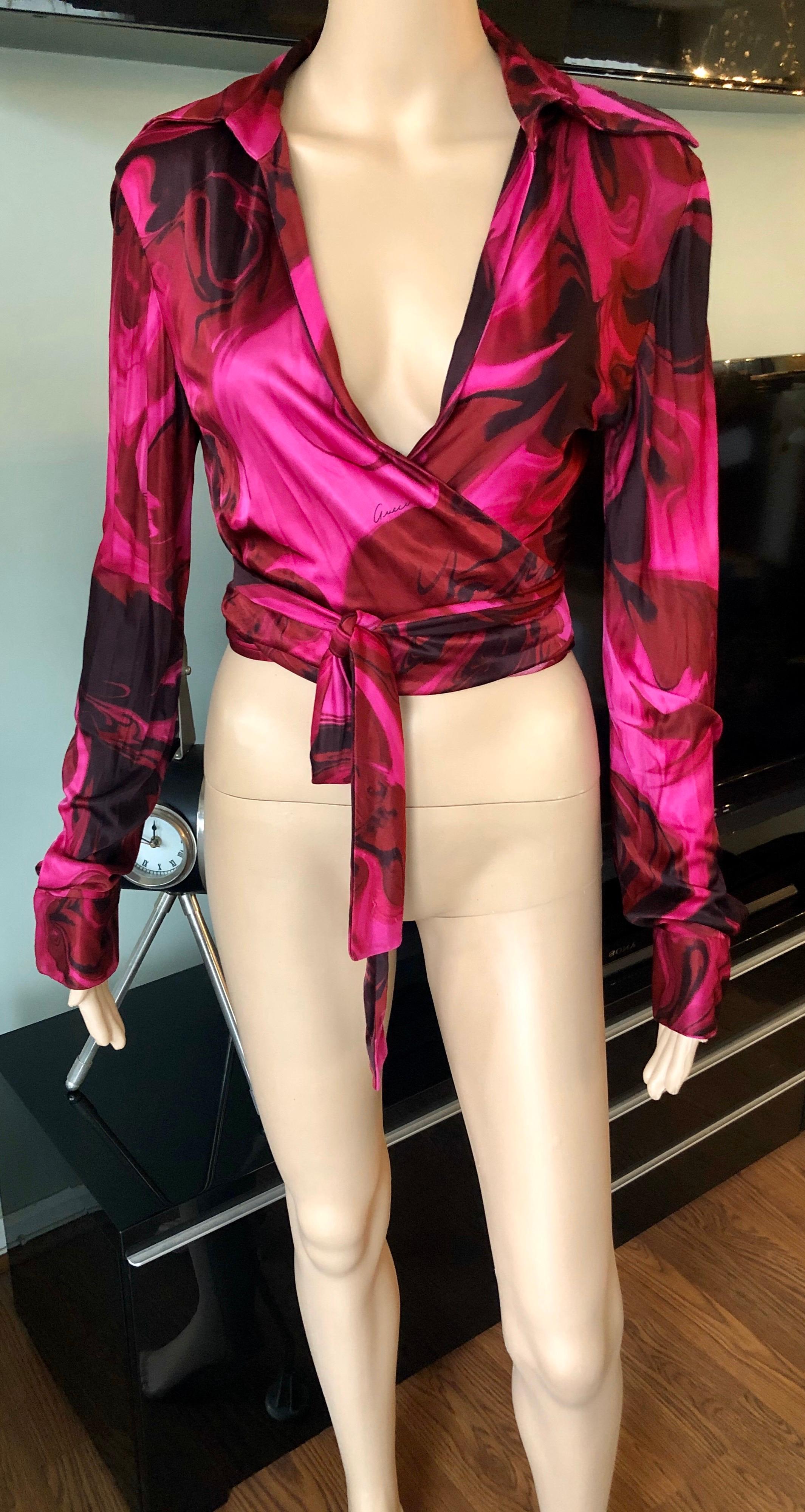 Tom Ford for Gucci S/S 2001 Plunging Neckline Wrap Crop Top Blouse IT 40

Gucci hot pink printed wrap crop top featuring plunging neckline, sash-tie closure at front and long sleeves.
