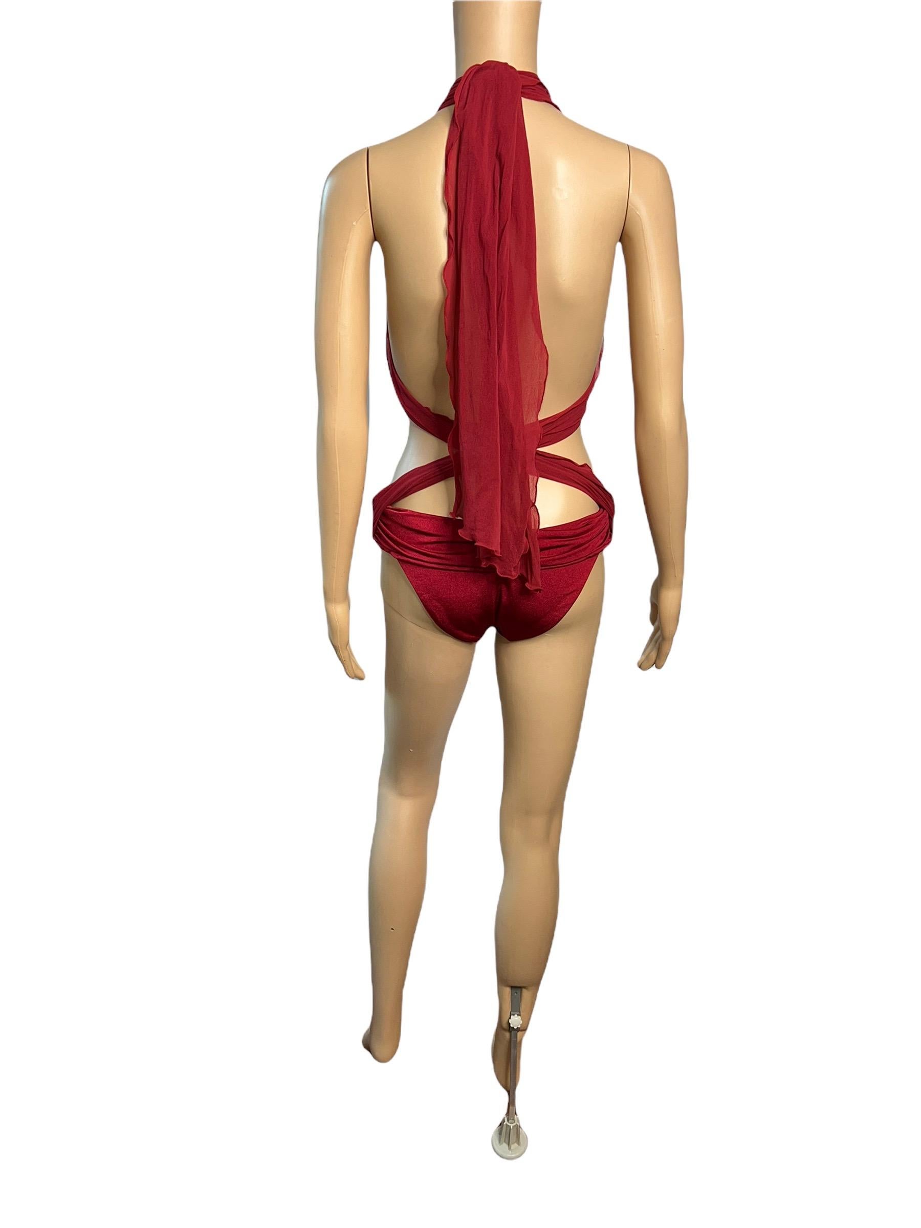 Tom Ford for Gucci S/S 2001 Runway Sheer One Piece Bodysuit Swimsuit Swimwear Size L 

Look 35 from the Spring 2001 Collection

Please note this swimsuit can be styled a few different ways based on preference as seen in the photos.

