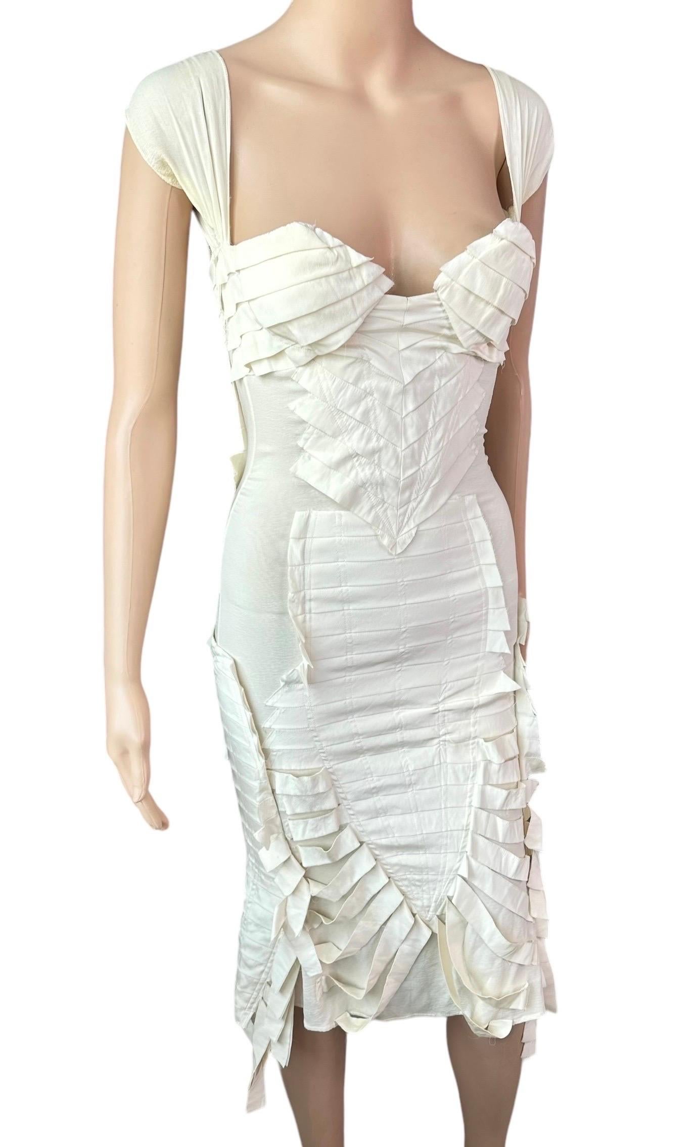 Tom Ford for Gucci S/S 2004 Runway Bustier Open Back Fringe Silk Ivory Dress

Size IT 42

Gucci by Tom Ford ivory stretchy silk dress featuring bustier plunging neckline, fringe trim at hem, frayed detail, open back with hook-and-eye closures and