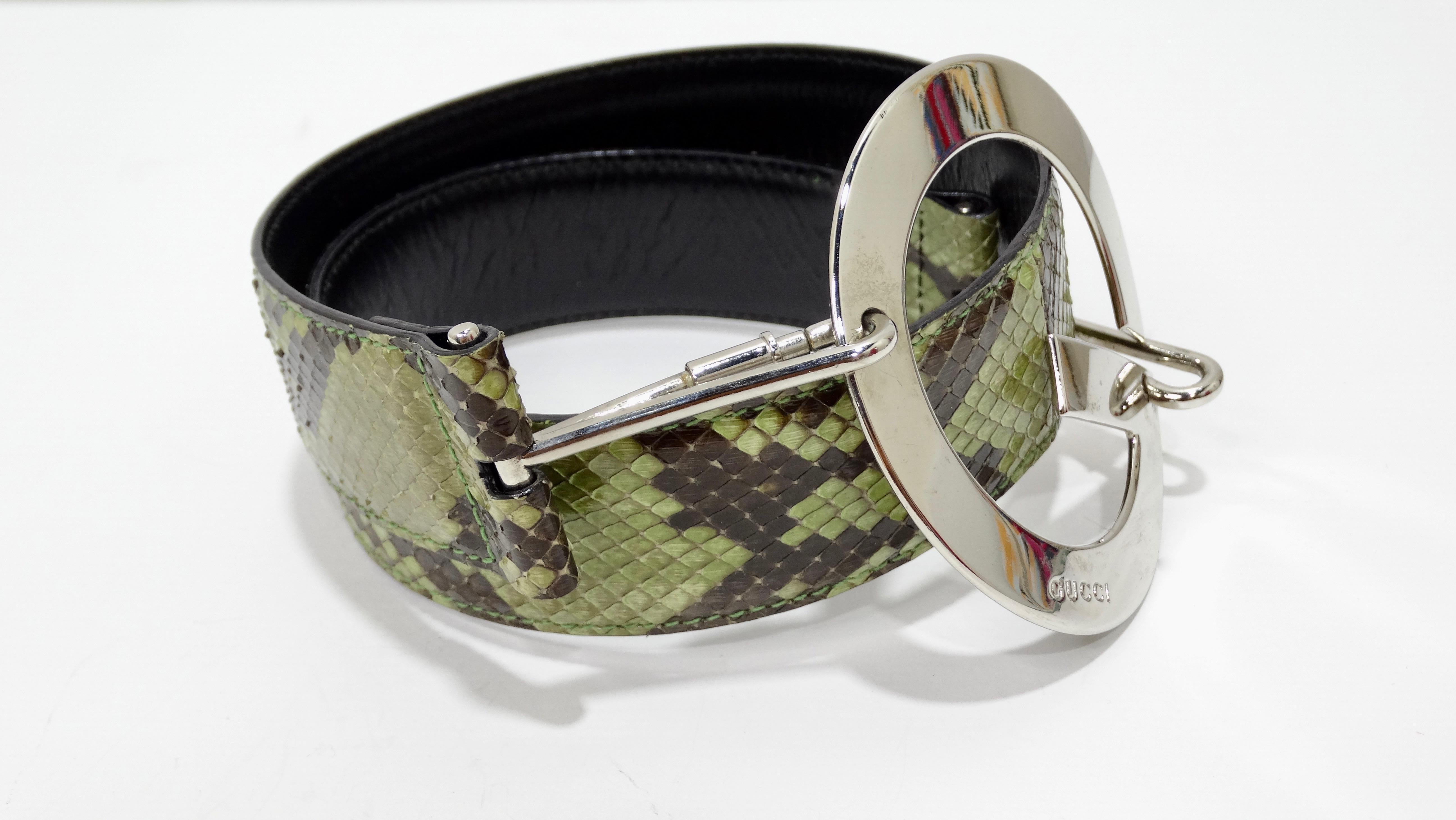 Spice up your looks with this amazing Tom Ford for Gucci belt! Circa late 90s/early 2000s, this belt is crafted from olive green and brown snakeskin and features carabiner closures and a large silver-tone 