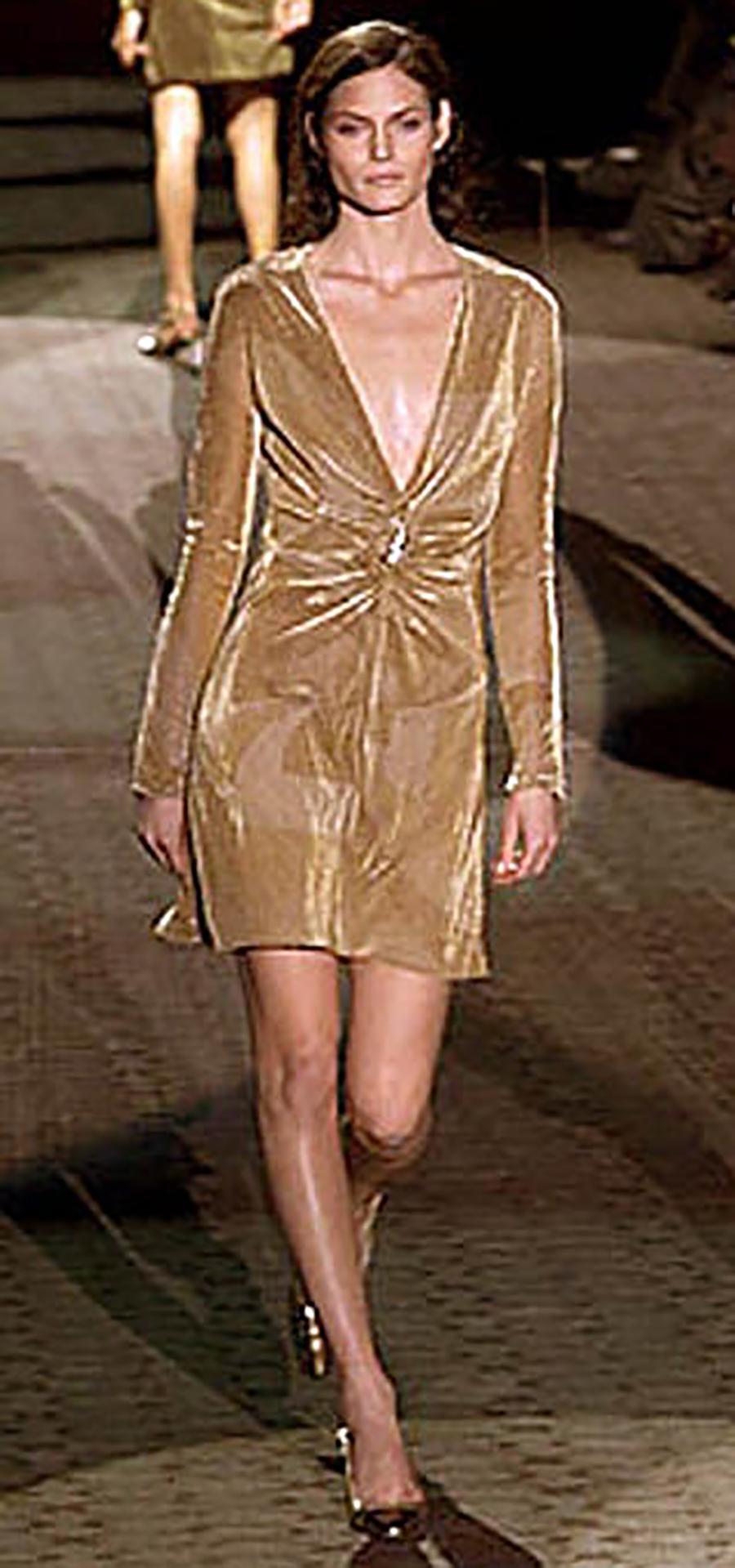 TOM FORD FOR GUCCI 

Autumn/Winter 2000 Collection

Tom Ford For Gucci Gold Dress With Lion Brooch


Content: 54% polyester, 46% nylon


Fully lined 

IT Size 40 - 4

armpit to armpit 19