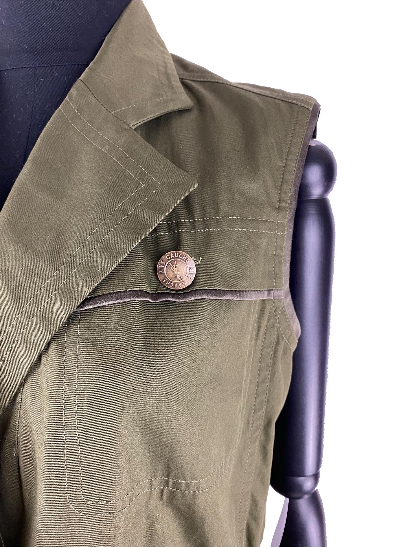 A Yves Saint Laurent tailored vest from the Tom Ford era in an army green dating back to the mid-2000s. This vest is fitted to the body by pulling the corded drawstring at the waist for a sculpted silhouette. The satin panel at the hem in the same