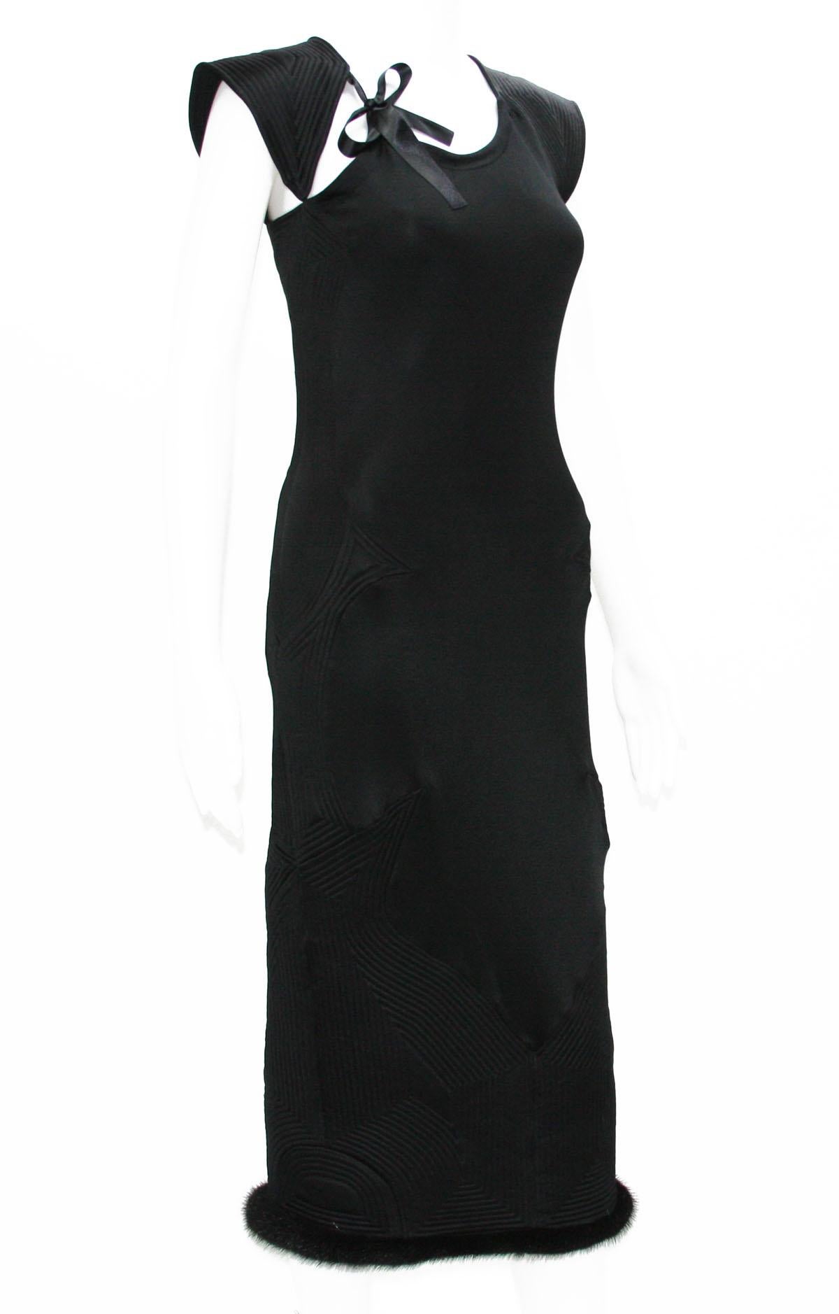 Collectible TOM FORD for YVES SAINT LAURENT Black Stretch Dress
Designer Sizes available - M and XS
Fall/Winter 2004 Collection
Color – Black
Rib Detail Throughout, Bow Accent at Neckline, Mink Fur Trim at Hemline, Zip Closure on Side, Fabric is