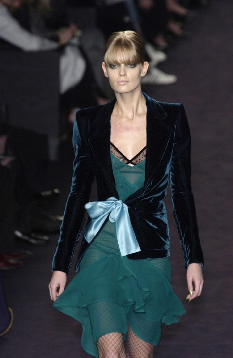 Famous Tom Ford for Yves Saint Laurent Rive Gauche Green Velvet Bow Blazer, as seen on Demi Moore, AD and Tom Ford Book.
F/W 2003 Runway Collection
Approx. French size 36 - US 4
Velvet jacket features a fitted body, patch pockets, and sash tie front