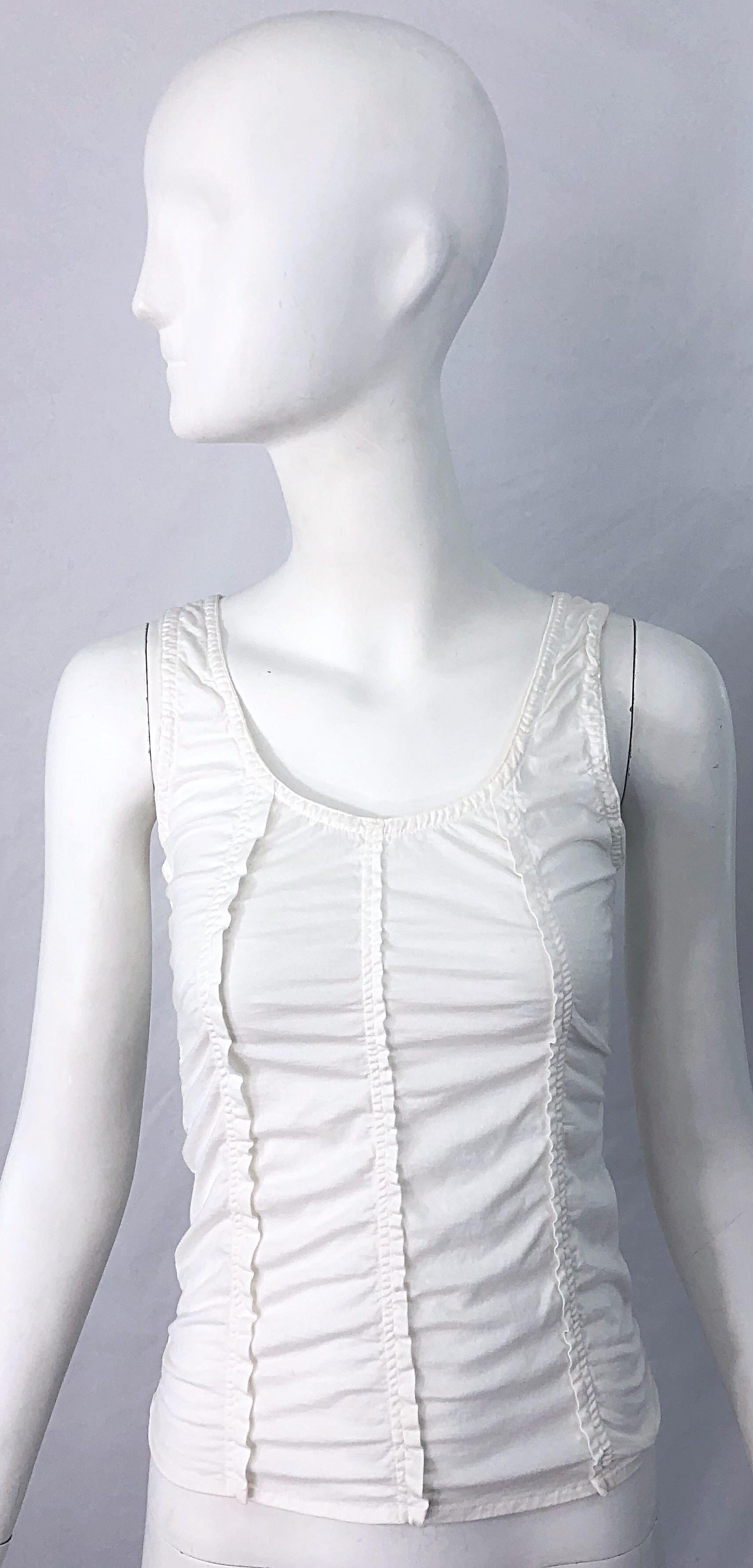 The perfect white tank! TOM FORD for YVES SAINT LAURENT white cotton sleeveless tank top shirt ! Features flattering vertical rows of ruffles down the front and back. Simply slips over the head, and stretches to fit. Can easily be dressed up or
