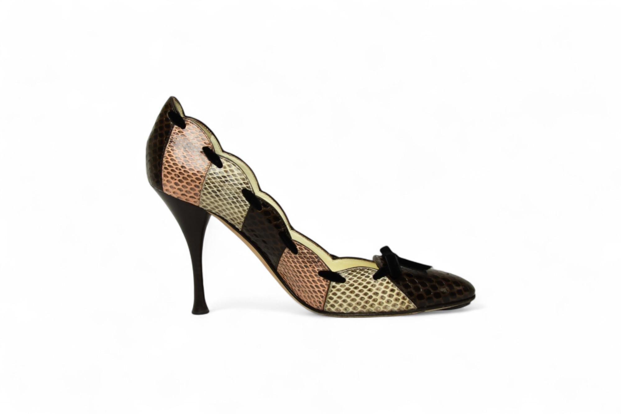 Elevate your collection with these striking Tom Ford for Yves Saint Laurent pumps, crafted in Italy from genuine python leather. Designed in the style of 1930s Art Deco, the patchwork motif features warm tones of chocolate brown, blush pink, and