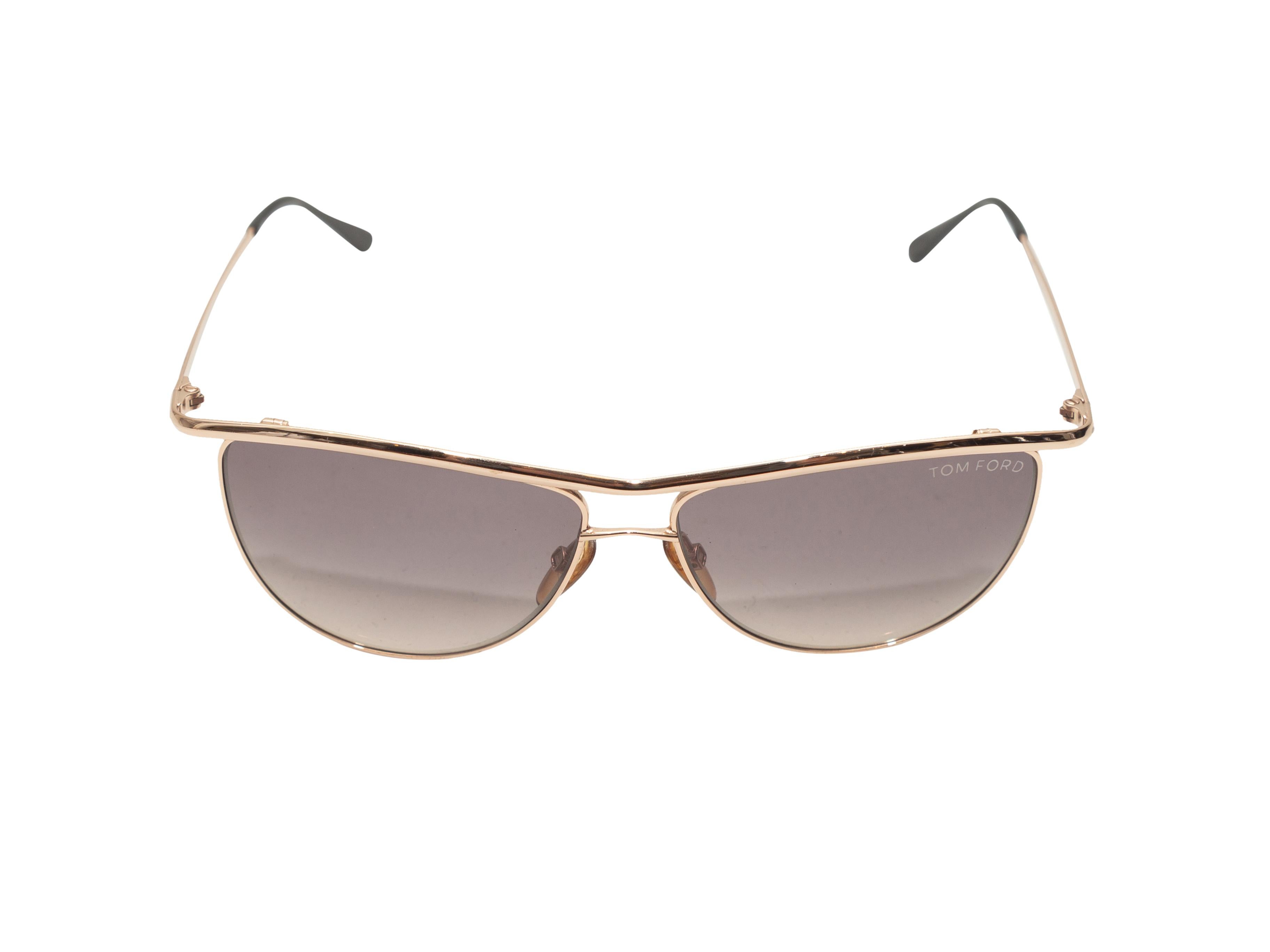 Product details: Gold metal Helene aviator sunglasses by Tom Ford. Grey tinted lenses. 5.5