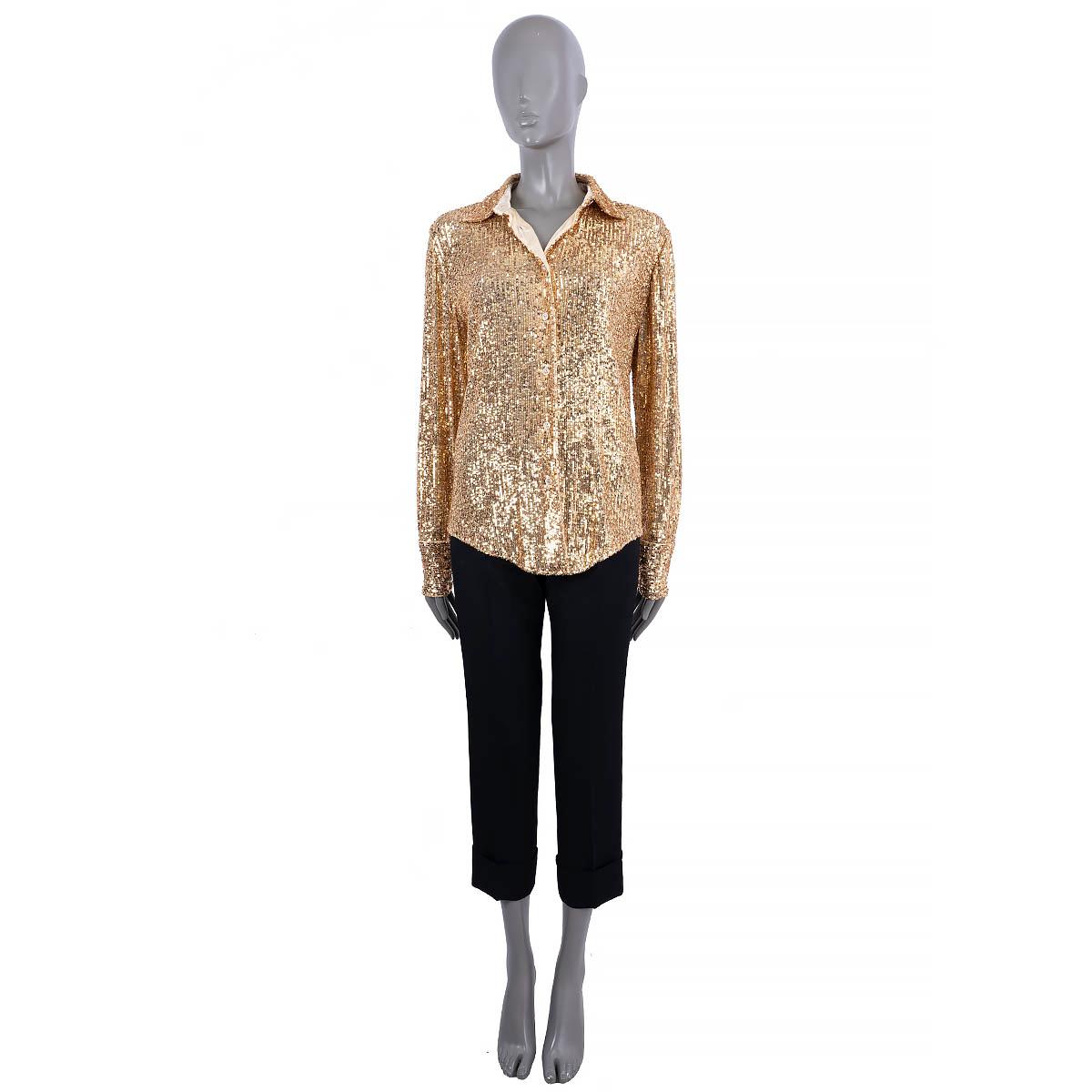 100% authentic Tom Ford sequin shirt in gold polyester (100%). Features long sleeves with buttoned cuffs. Closes with buttons in the front. Lined in silk (94%) and elastane (6%). Has been worn and is in excellent condition. 

Measurements
Tag