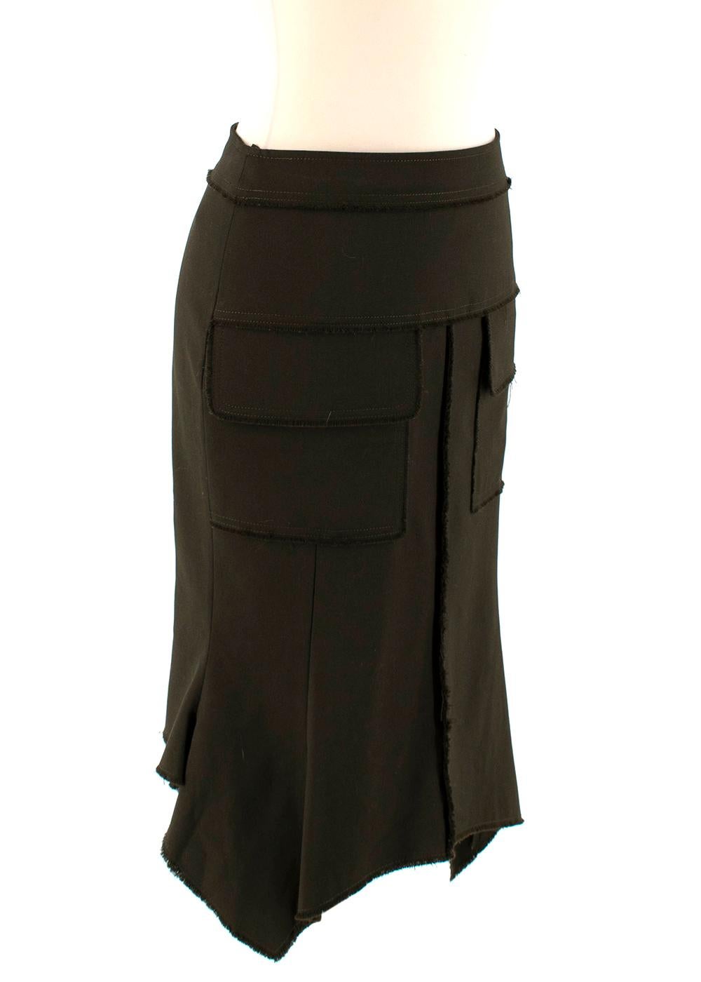 Tom Ford Green Fit & Flare Utility Skirt

- Made of soft lightweight wool 
- Gorgeous dark green hue 
- Fringed details to the seams 
- Pockets to the front 
- Uneven flared hems 
- Elegant versatile design 

Materials:
99% wool, 1% elastane 

Dry