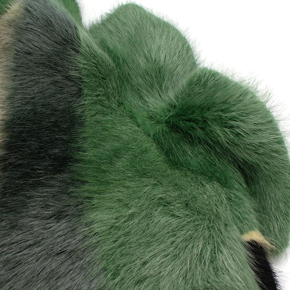 Tom Ford Green Intarsia Coypu Fur Coat

- Centre Hook Fastening 
- Lapel Collar
- Two Lined Front Pockets 
- Fully Lined 
- Green White and Black Pattern 

Material: 
- 100% Coypu and Mink Fur 
-  82% Viscose Lining 
- 18% Silk Lining 

Made in
