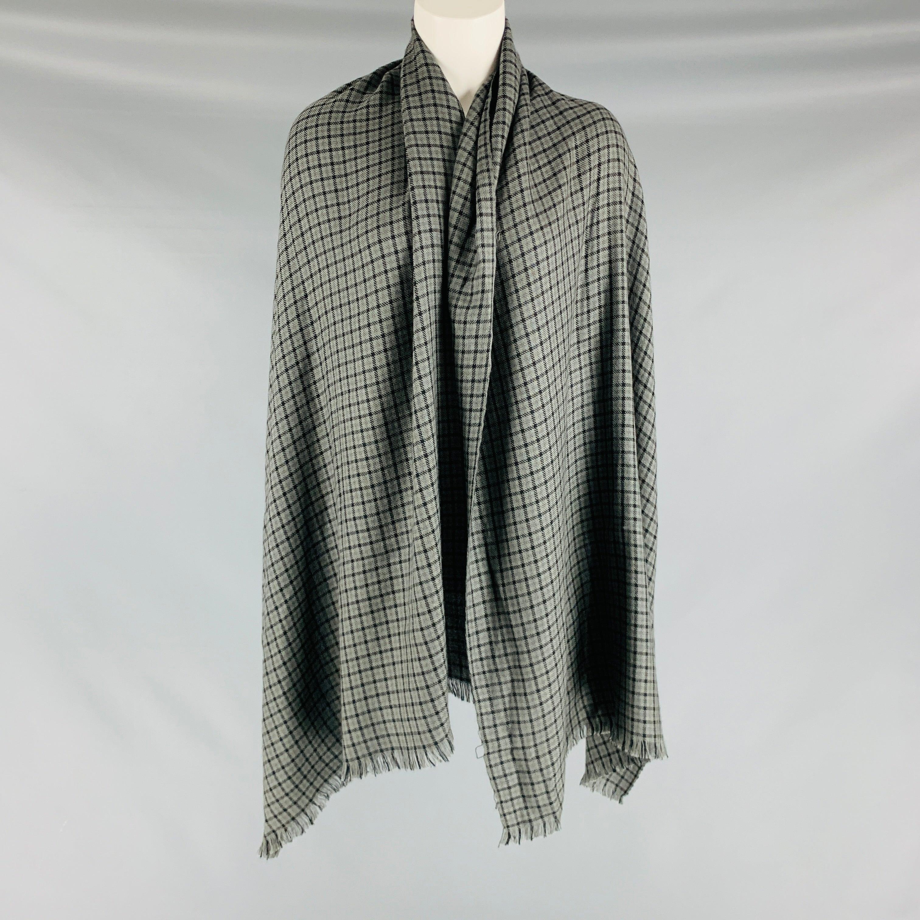 TOM FORD scarf in a grey and black checkered woven featuring raw edge. Very Good Pre-Owned Condition. Minor signs of wear. 

Measurements: 
  70 inches  x 12.5 inches  
  
  
 
Sui Generis Reference: 128743
Category: Scarves
More Details
    
Brand: