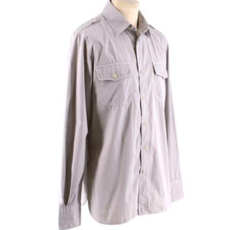 Tom Ford Grey Cotton Long Sleeve Casual Shirt

- Made of soft cotton 
- Neutral grey hue 
- Classic long sleeve cut 
- Button fastening to the front 
- Buttoned cuffs 
- Pockets to the chest 
- Military details to the shoulders 
- Timeless elegant