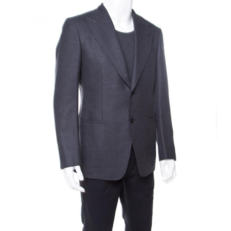 Look stunning from every angle in this Tom Ford well-tailored blazer. This amazing grey piece flaunting patterned jacquard knitting and an elegant finish. Stay dapper all day long in this blazer made from a mohair blend. It has long sleeves, notched