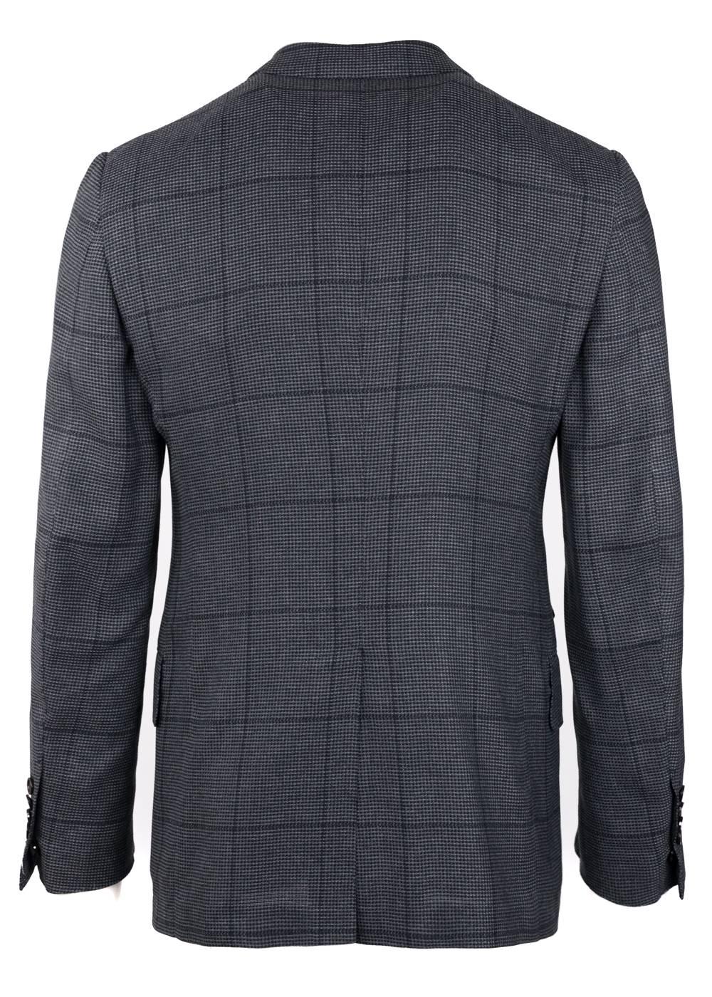 The signature Tom Ford Shelton Jacket updated in a 100% silk textile with a windowpane design. This constructed Shelton base jacket is finished with notch lapels with flap pockets in a two button silhouette. The jacket has a windowpane pattern to