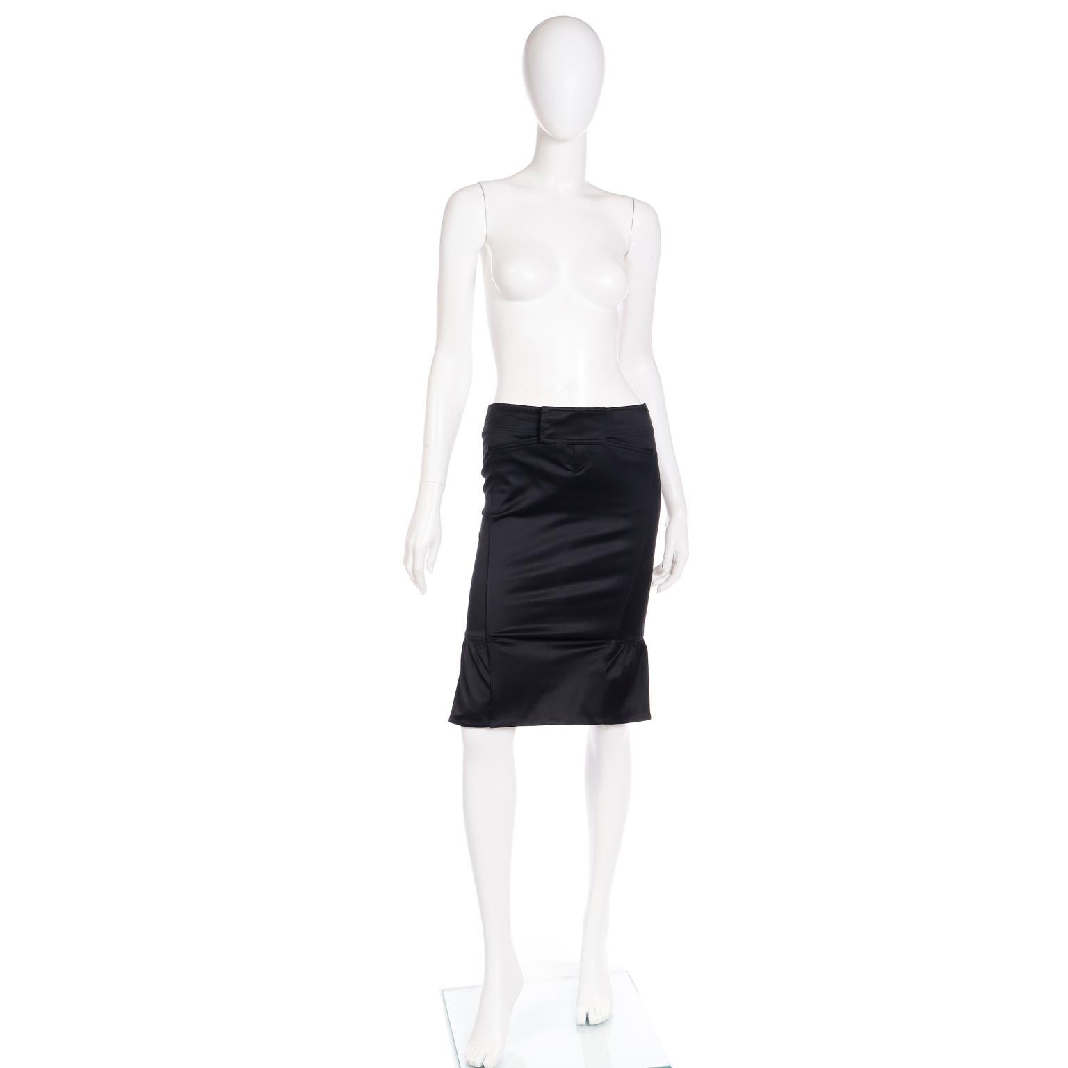 
The incredible vintage Tom Ford for Gucci black cotton skirt has so many fun details! The skirt is meant to be worn very close to the body and is similar to a pencil skirt with a very slight flare created by the unique gathering on the sides around