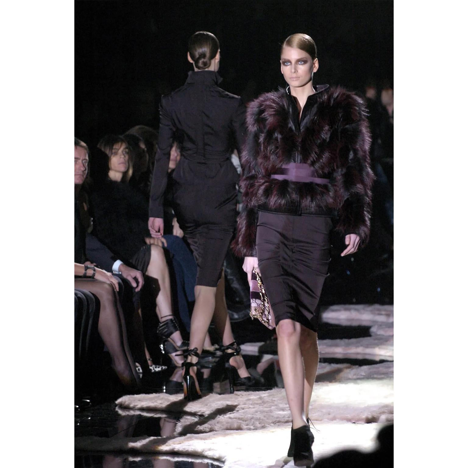 This is a stunning deadstock Tom Ford for Gucci Fall Winter 2004 dark plum brown pencil skirt with a band in back that hugs the body near the hemline. The skirt is unlined and has a fair amount of stretch. Skirts like these from the early 2000's
