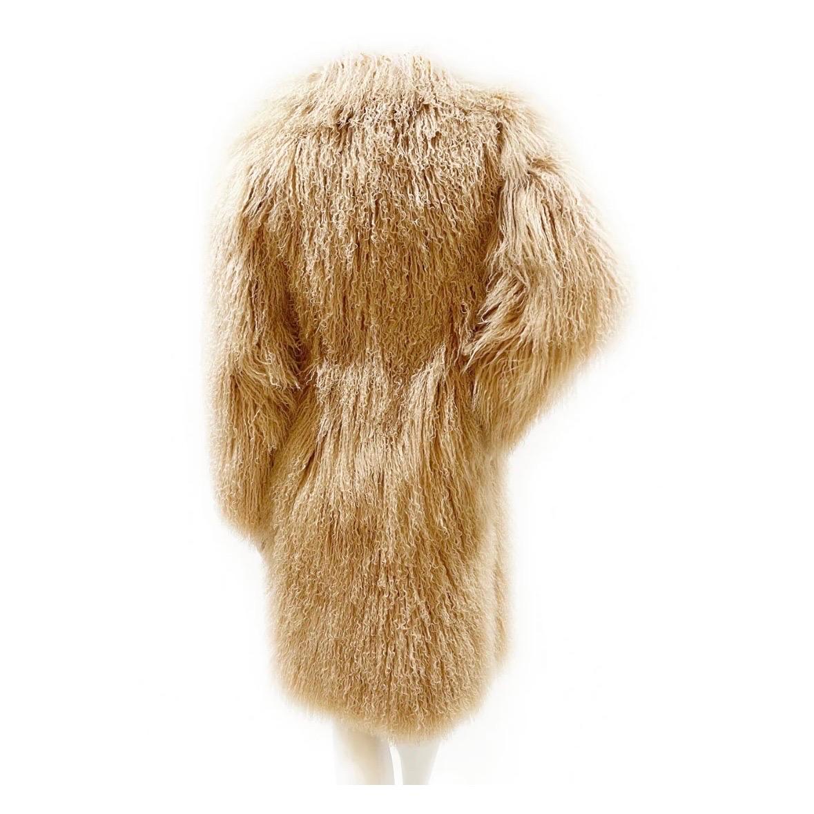 Mongolian lamb fur coat by Tom Ford for Gucci 
Fall 2001 Ready-to-Wear
Made in Italy
Tan Mongolian lamb fur
Double hook front closure
Knee-length 
Functioning oversized side zippers 
Dual slit pockets at hips
100% genuine fur, 100% silk lining