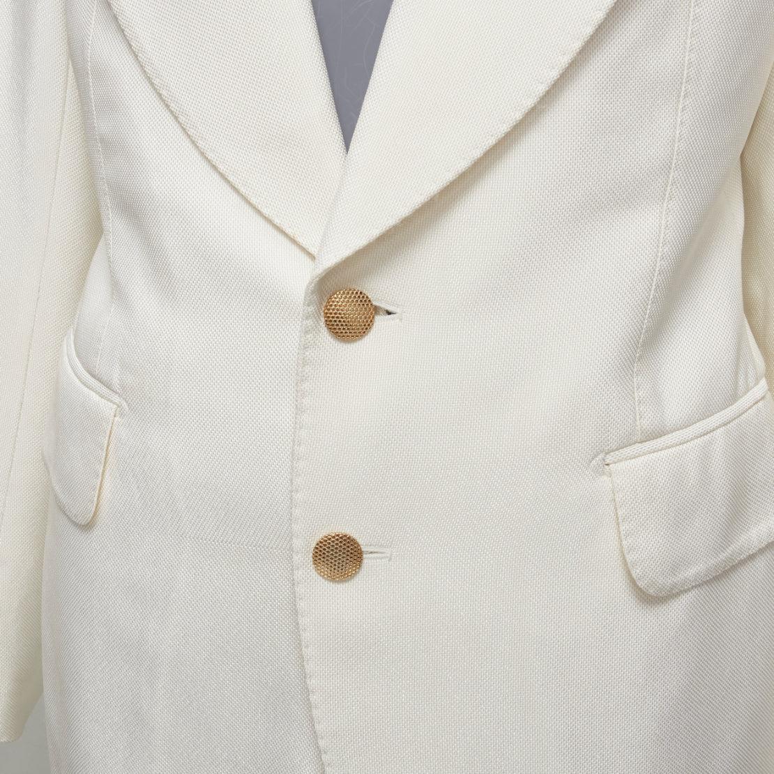 TOM FORD ivory wide lapels gold2- button blazer jacket pants suit IT44 L
Reference: GIYG/A00359
Brand: Tom Ford
Designer: Tom Ford
Material: Viscose
Color: Cream
Pattern: Solid
Closure: Button
Lining: Cream Silk
Extra Details: Gold hardware at