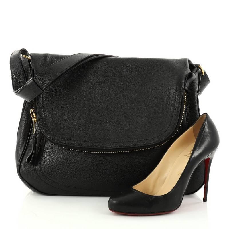 This authentic Tom Ford Jennifer Shoulder Bag NM Leather Medium redefines modern luxury with timeless elegance. Crafted in classic black leather, this signature saddle shoulder bag features flat leather shoulder strap, zip-top fold-over flap,