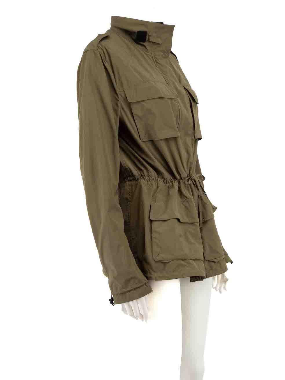 CONDITION is Very good. Minimal wear to jacket is evident. Minimal wear to the right sleeve with tiny mark on this used Tom Ford designer resale item.
 
 Details
 Khaki
 Polyester
 Windbreaker utility jacket
 Hip length
 3x Drawstring on waistline
