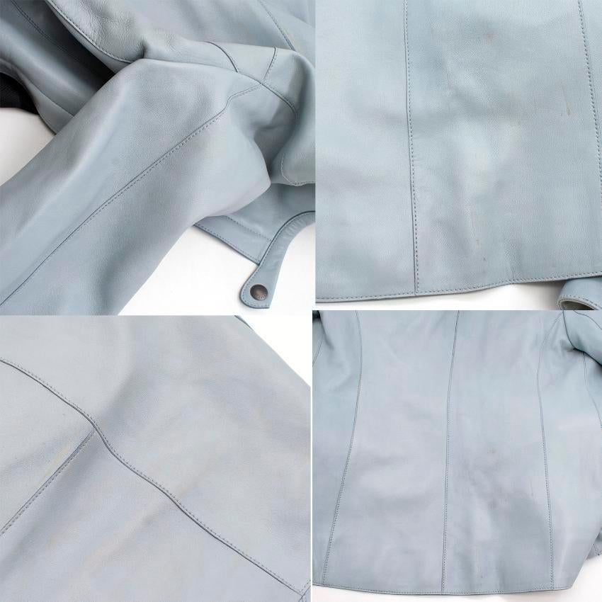 Tom Ford light blue leather jacket. 
Made in Italy. 

Fabric: Lamb leather/100% Silk. 

Features a round collar, four front flap pockets, long sleeves and front zip closure. 
Measurements are taken laying flat, seam to seam. 

Approx: 
Shoulders-