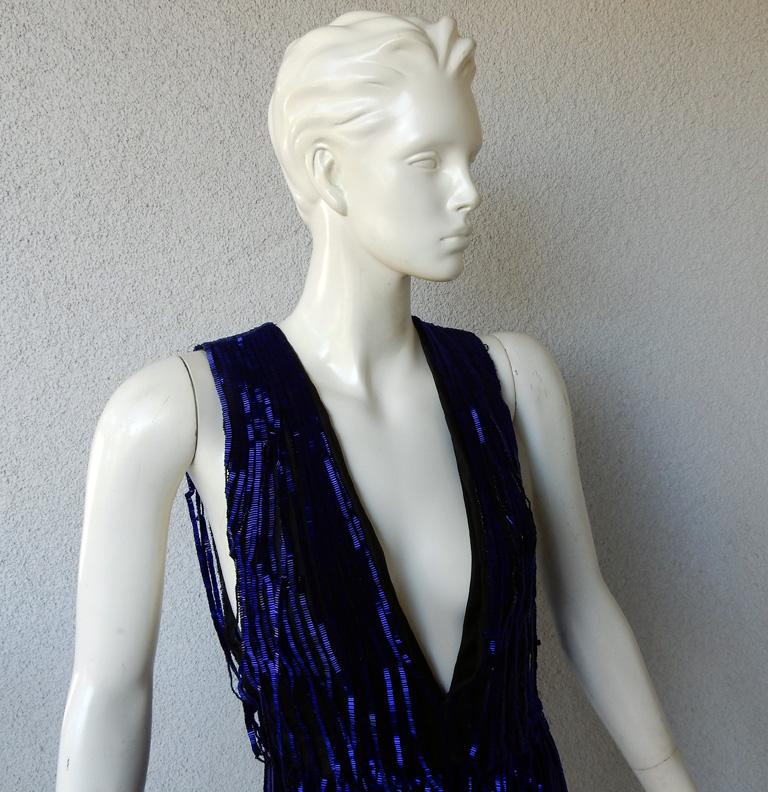 Tom Ford deco inspired hand beaded evening dress.   Boasts rich beautiful cobalt blue bugle beads all hand sewn atop black silk organza extending down to skirt featuring open work fringe to showcasing lots of leg.   Dress is 1 piece with additional