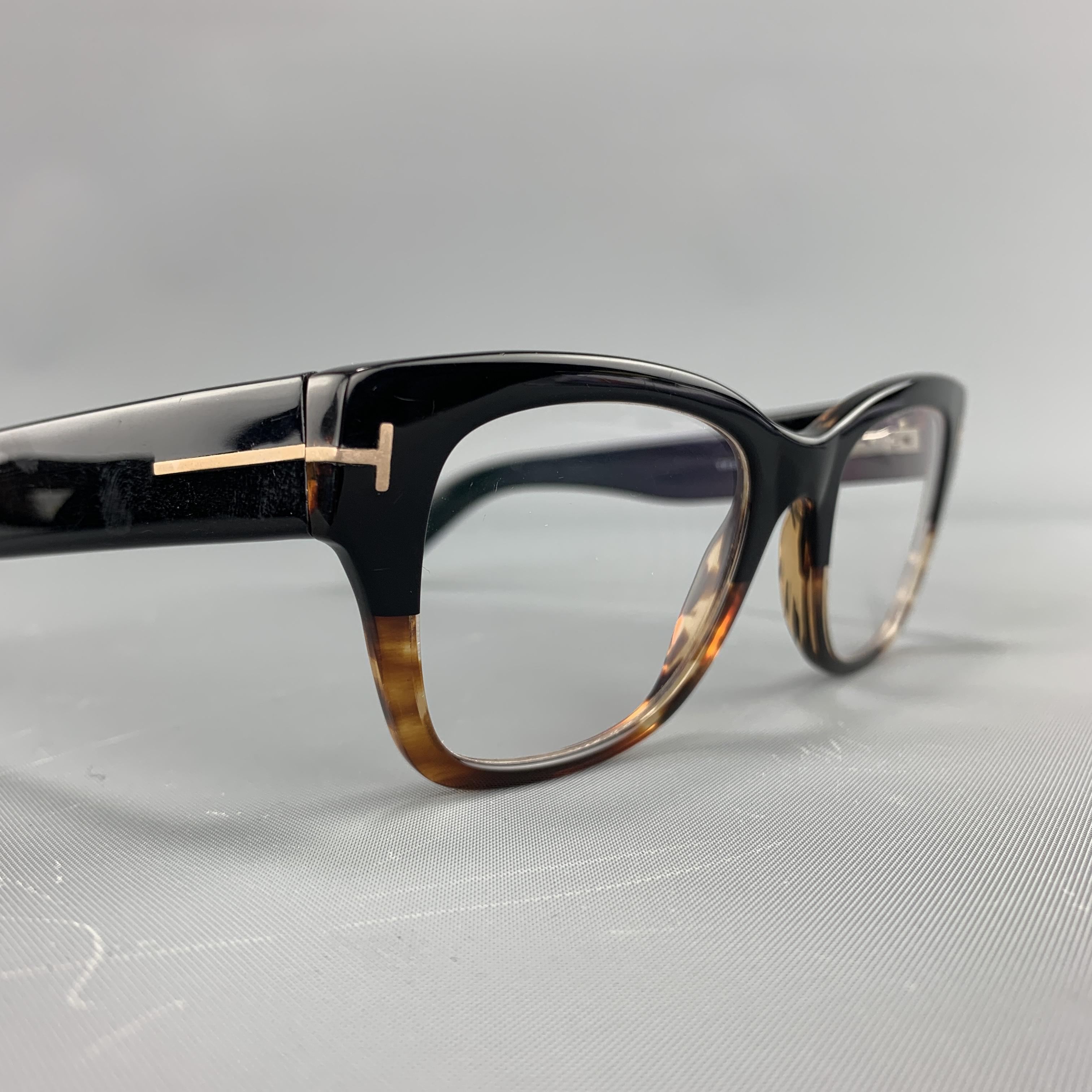 TOM FORD eyeglasses come in black and brown ombre acetate with a retro look. Prescription added As-is. With case.

Excellent Pre-Owned Condition.
Marked: TF5379 005 51 20 145

Measurements:

Length: 14 cm.
Height:  4.5 cm.