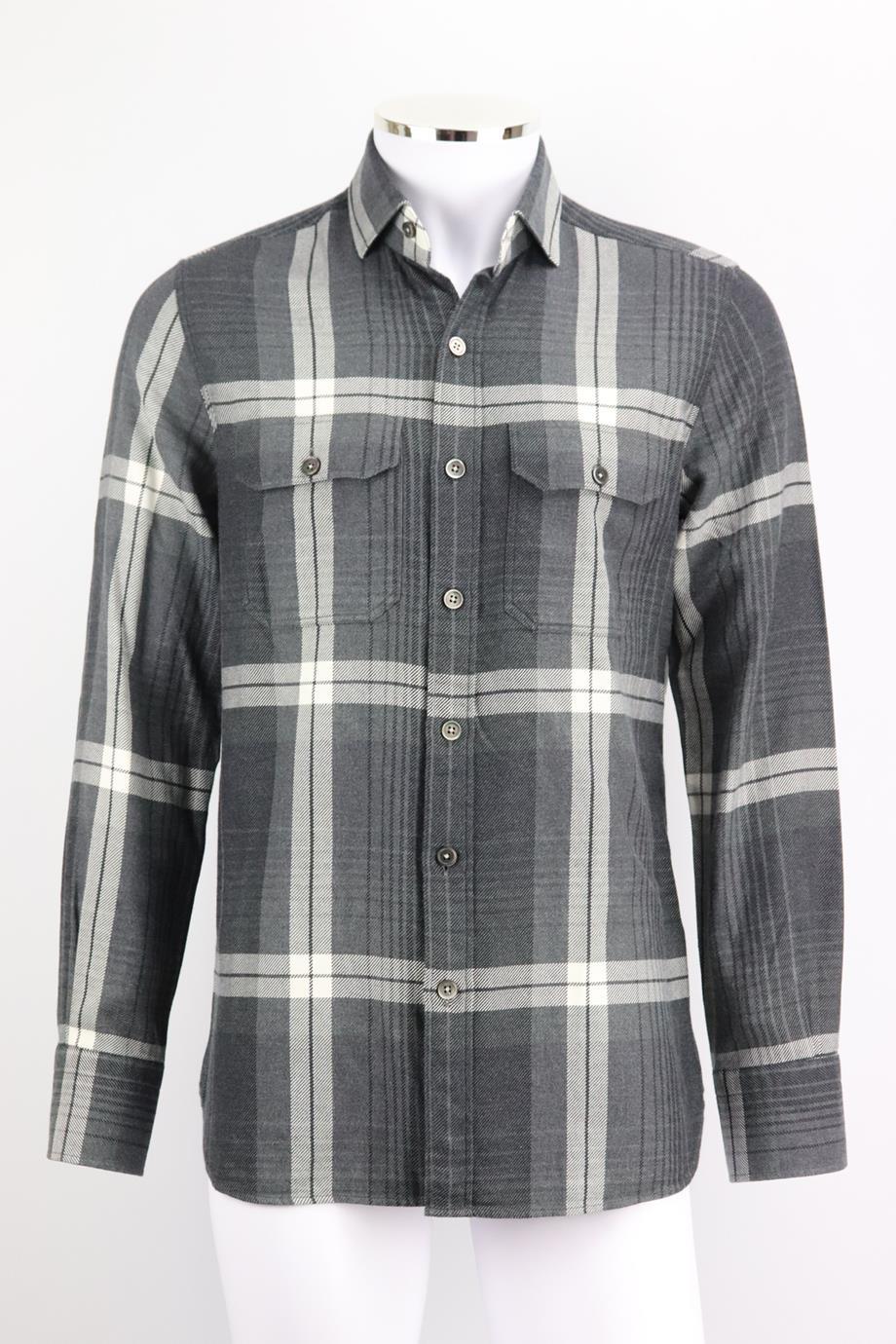 Tom Ford men’s checked cotton flannel shirt. Black, grey and white. Long sleeve, v-neck. Button fastening at front. 100% Cotton. Size: UK/US Chest 40 (Large, IT 50, UK/US Collar 16). Shoulder to shoulder: 17 in. Chest: 41 in. Waist: 37 in. Hips: 37
