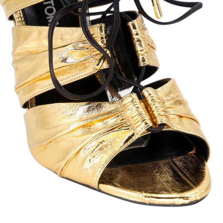 Tom Ford Metallic Laminated Eel Lace-up Sandal Gold Metallic Platforms

TOM FORD metallic laminated eel skin sandal with calf leather trim. 5
