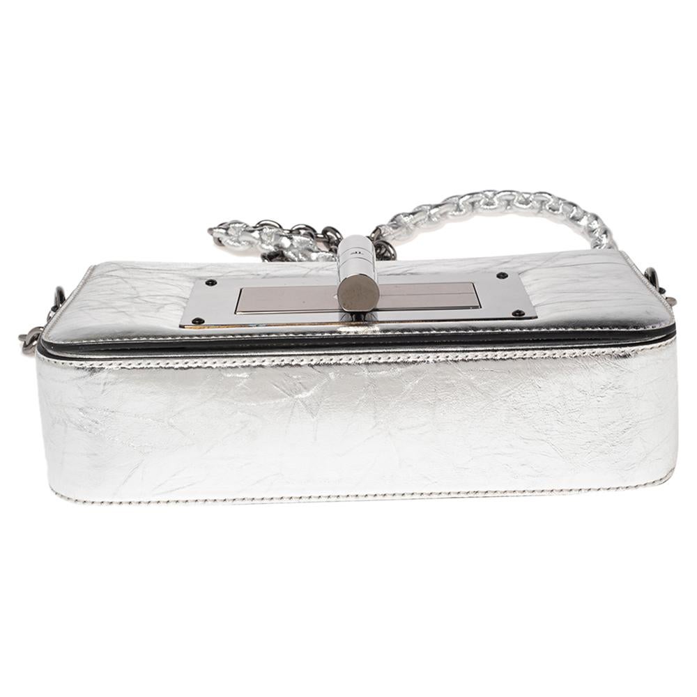 The Natalia bag from Tom Ford is here to end all your fashion woes, as it is striking in appeal and utterly high on style. It has been crafted from silver crackled leather and designed with a flap that has a large turn lock carrying the signature TF