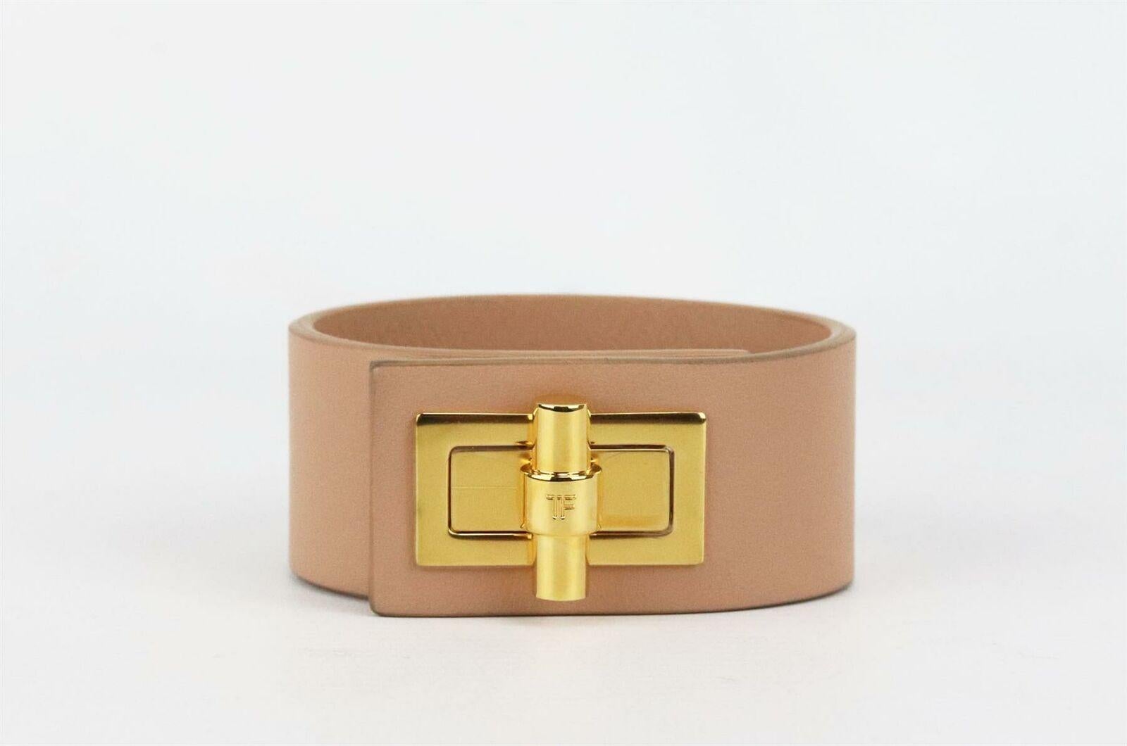 This Tom Ford cuff bracelet is a refined take on the brand's classic accessory, it's been crafted in Italy from smooth nude leather and finished with the label's instantly recognizable gold-tone twist-lock closure.
Nude leather.
Twist lock fastening