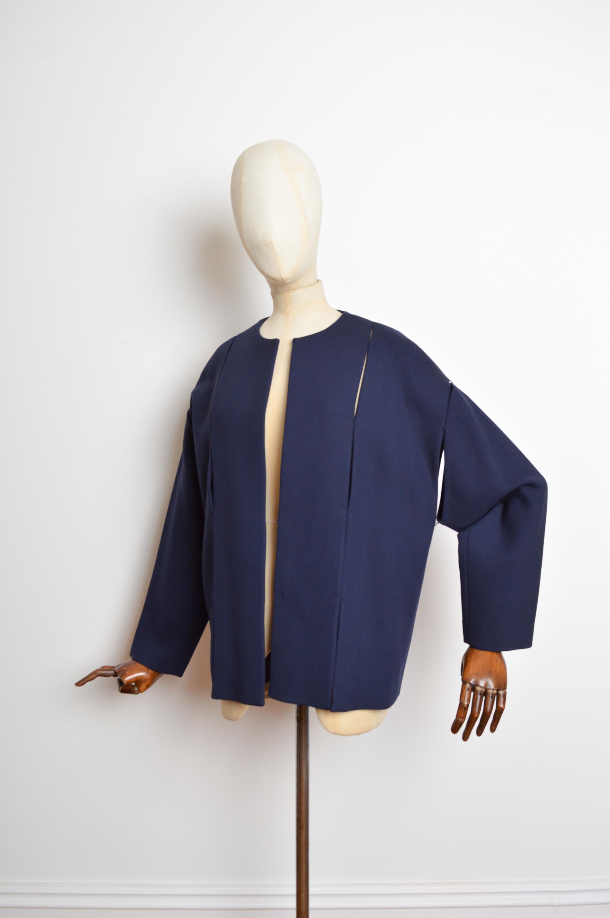 Superb midnight blue structured panel jacket by master craftsman, designer Tom Ford, featuring long sleeves and open front silhouette. 
Size; The garment will fit a variety of sizes due to the oversized nature of the design. U.K. 6-10.
Measurements