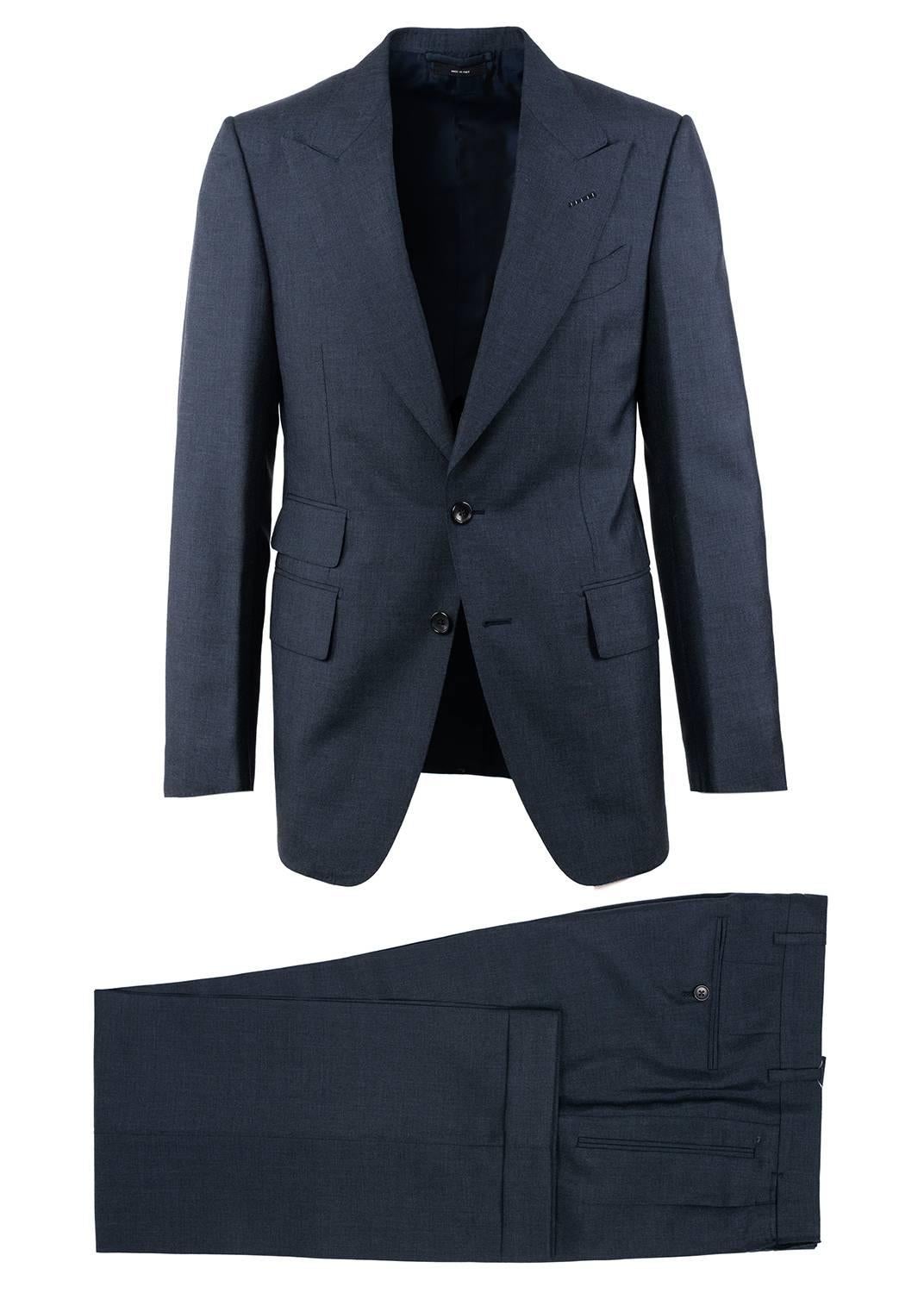 Specially crafted for the modern man Tom Ford introduces a updated signature two piece silhouette. Finished with pure mohair that provides a slight grey heather touch this suit included pleated front trousers, a peak lapel jacket, and signature Tom