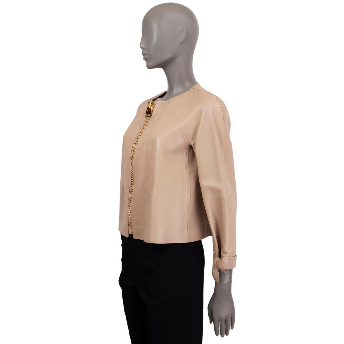 Tom Ford cropped jacket in nude nappa leather with heavy signature gold-tone metal zipper. Raglan sleeves with bow detail at bottom. Unlined. Has been worn once and is in excellent condition. 

Tag Size Missing Tag
Size S
Shoulder Width 39cm